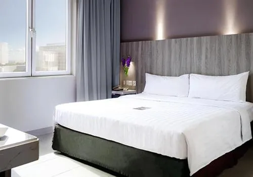 Bed in Royal Palm Hotel & Conference Center Cengkareng