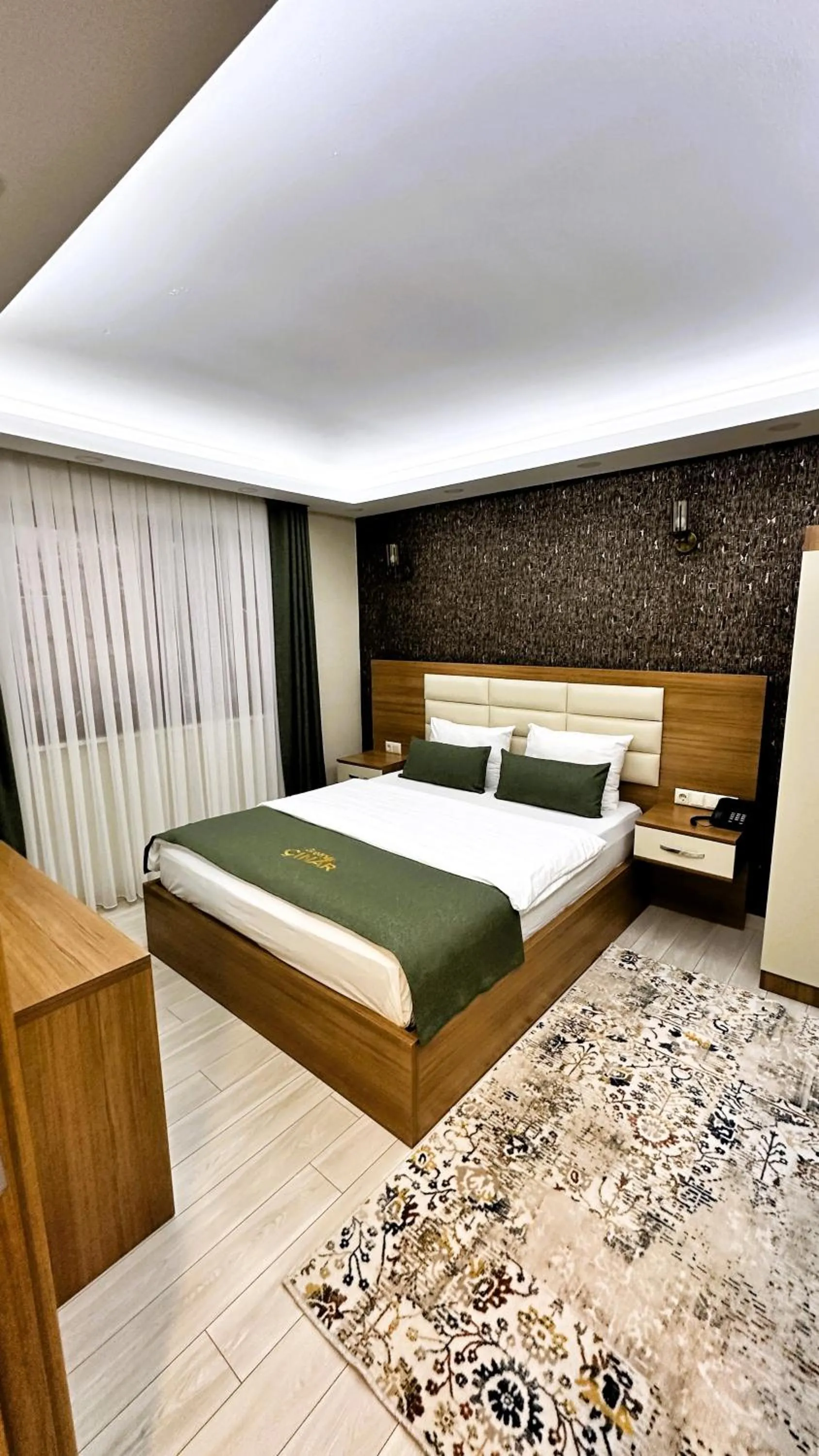 Bed in Green Cinar Apart