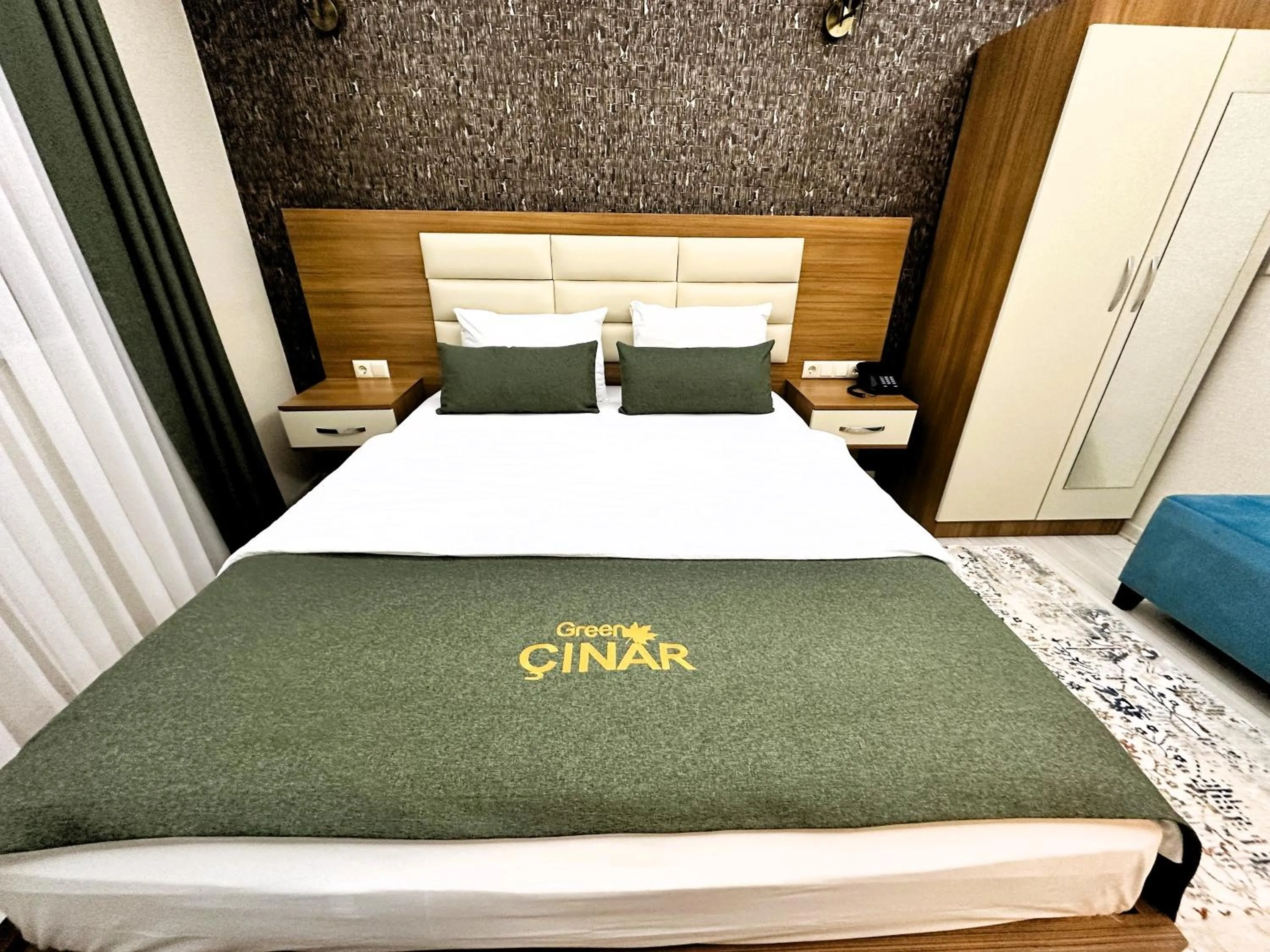 Bed in Green Cinar Apart