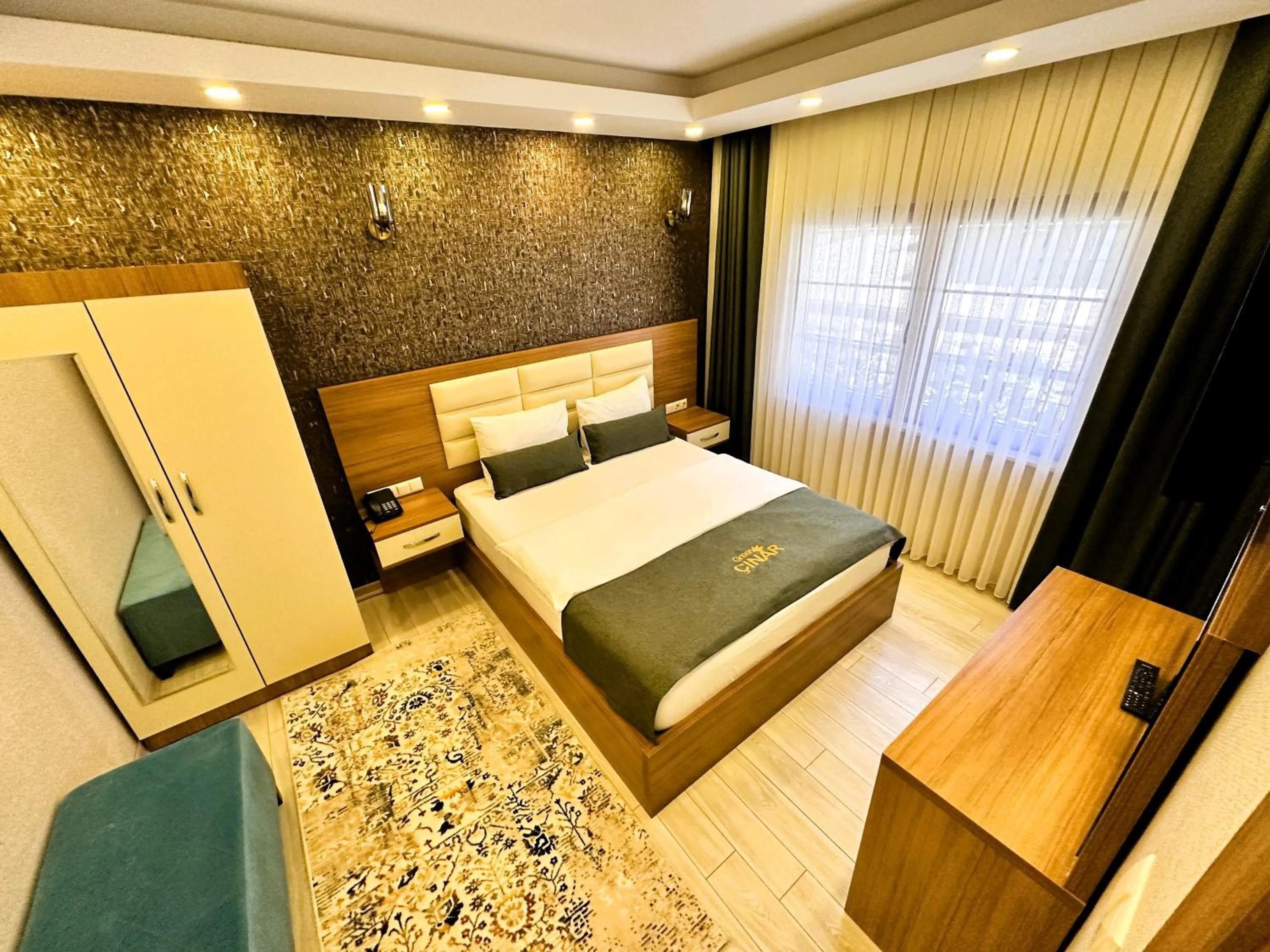 Bed in Green Cinar Apart