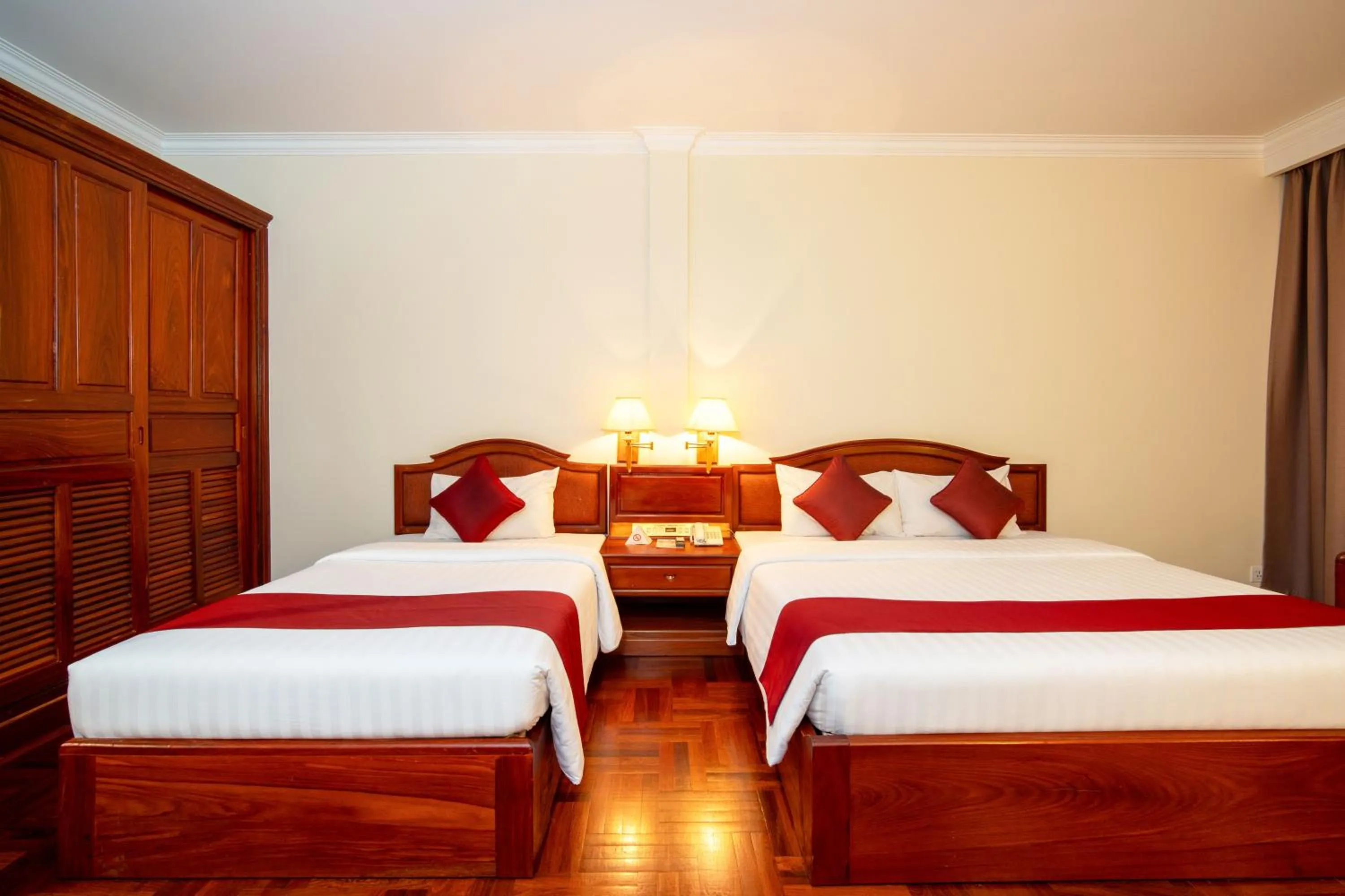 Bed in Khemara Angkor Hotel & Spa