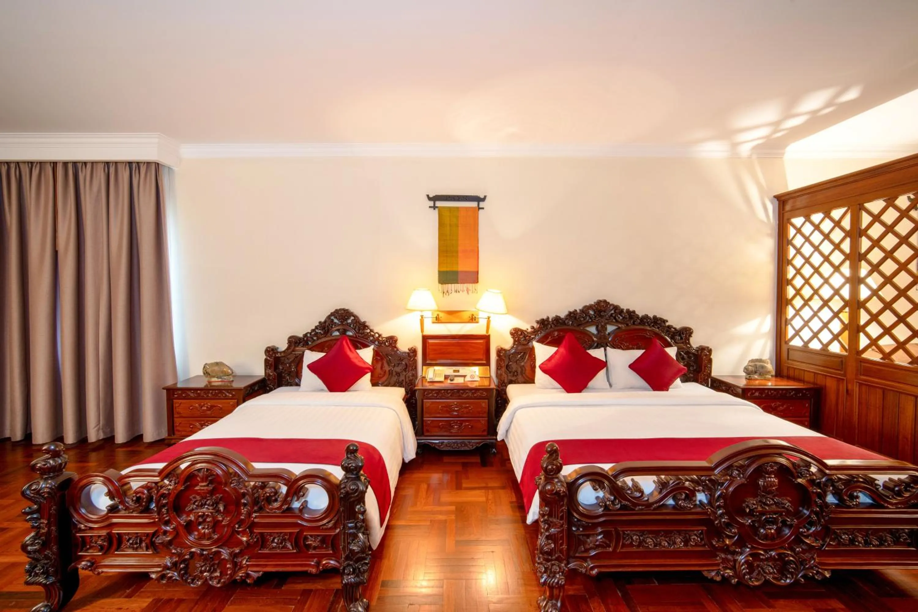 Bed in Khemara Angkor Hotel & Spa