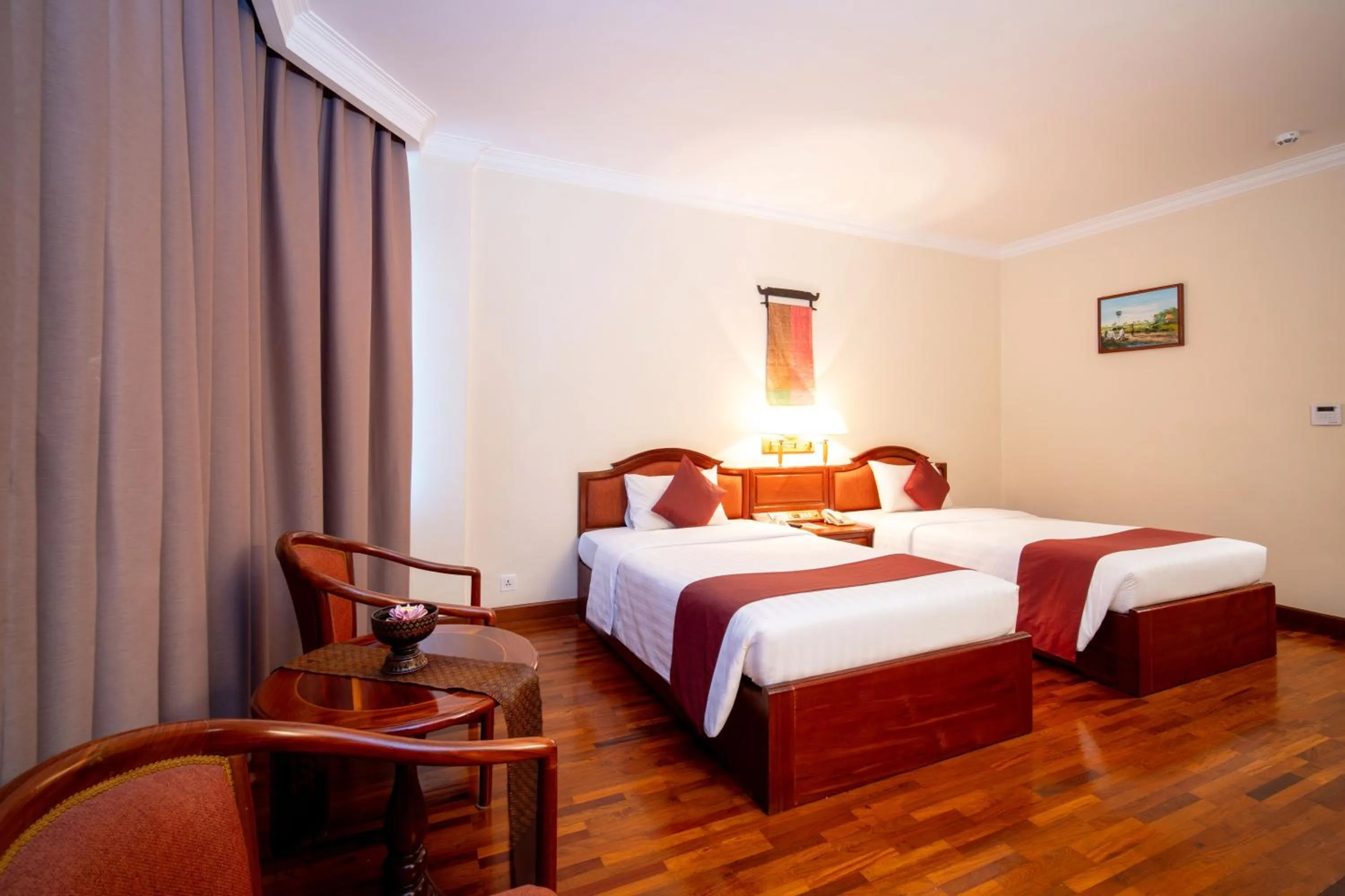 Bed in Khemara Angkor Hotel & Spa