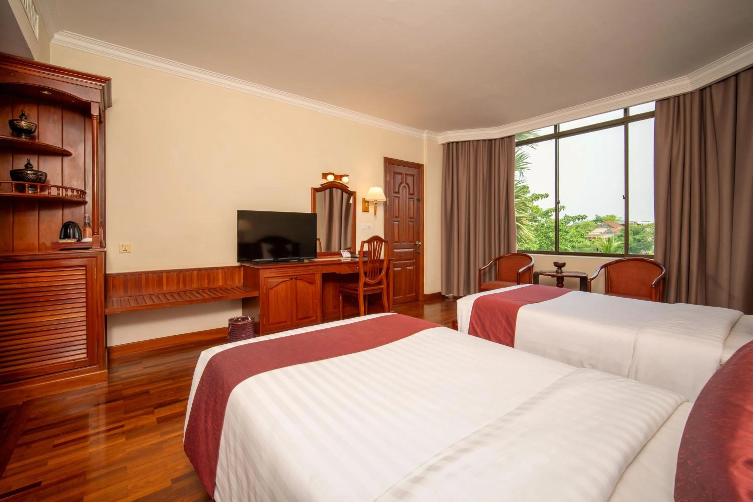 Communal lounge/ TV room, Bed in Khemara Angkor Hotel & Spa