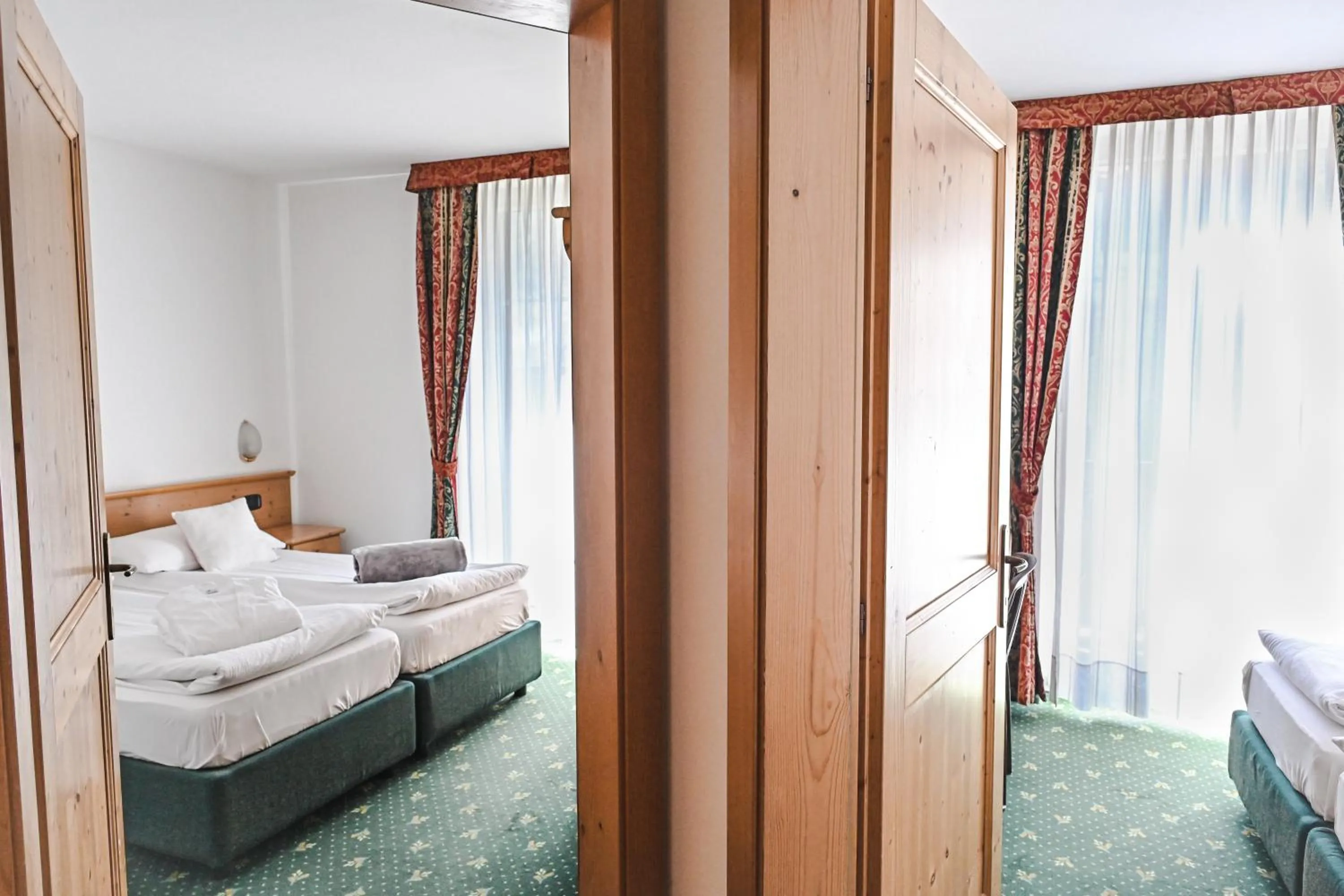 Bed in Alp Hotel Dolomiti