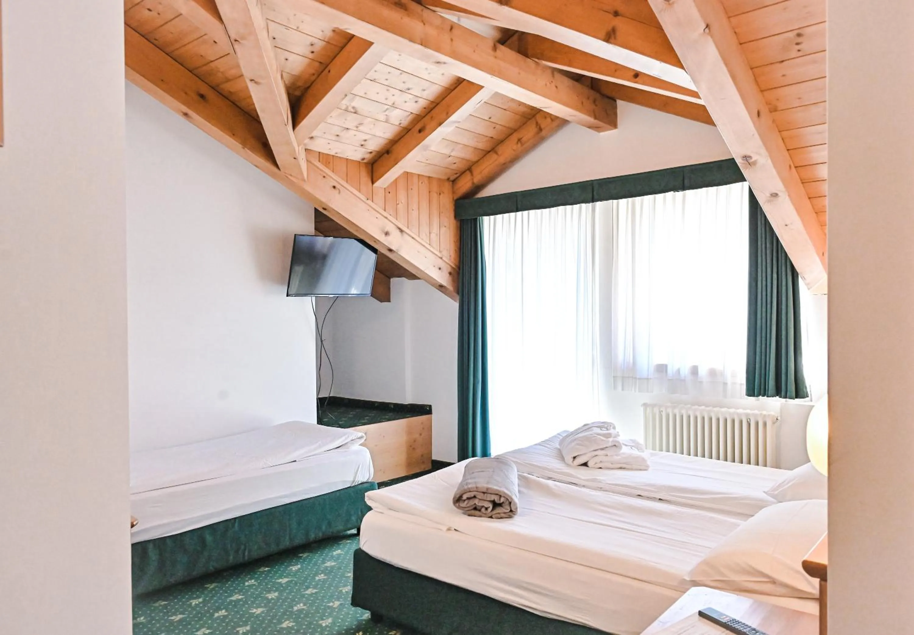 Bed in Alp Hotel Dolomiti