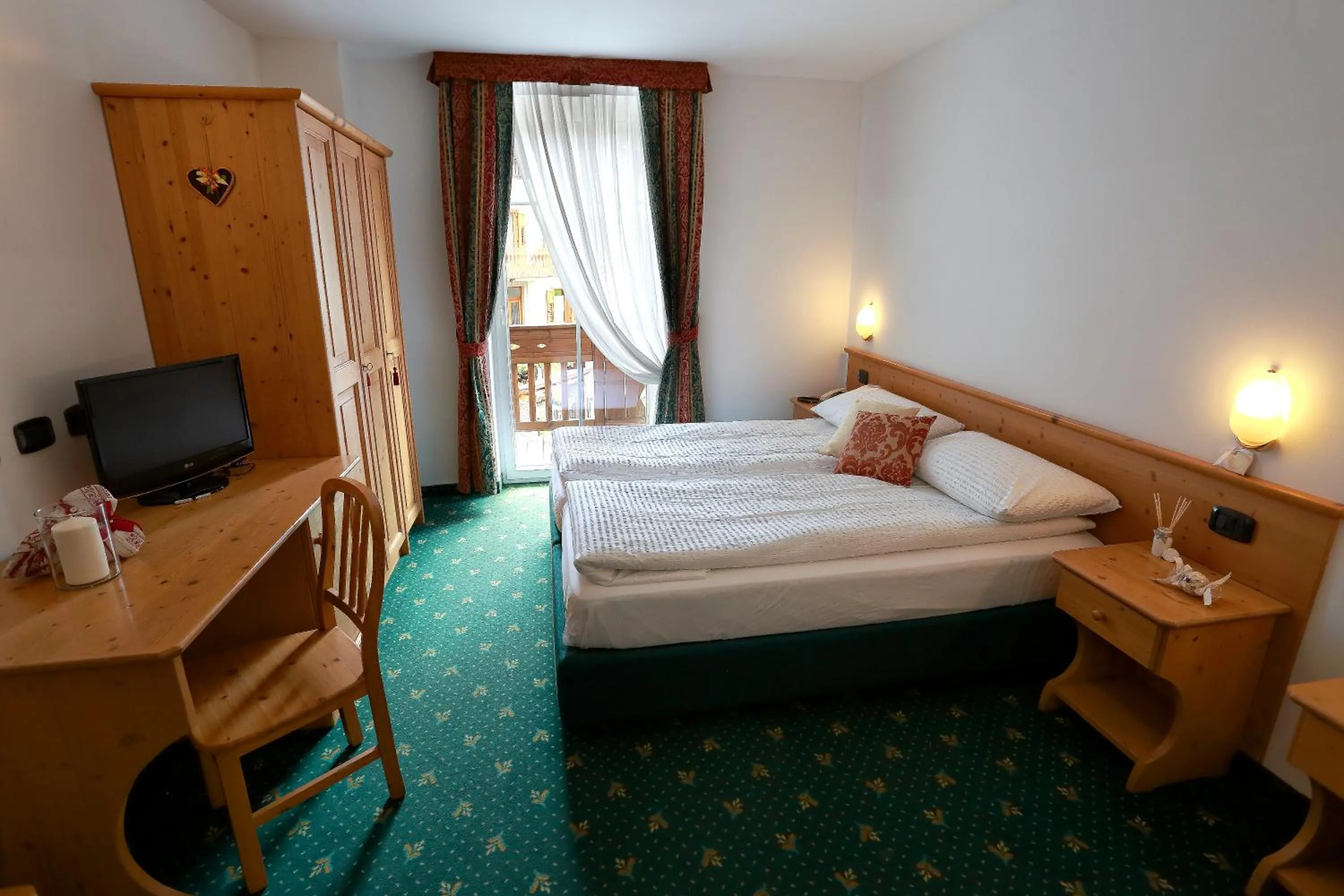 Bedroom, Bed in Alp Hotel Dolomiti