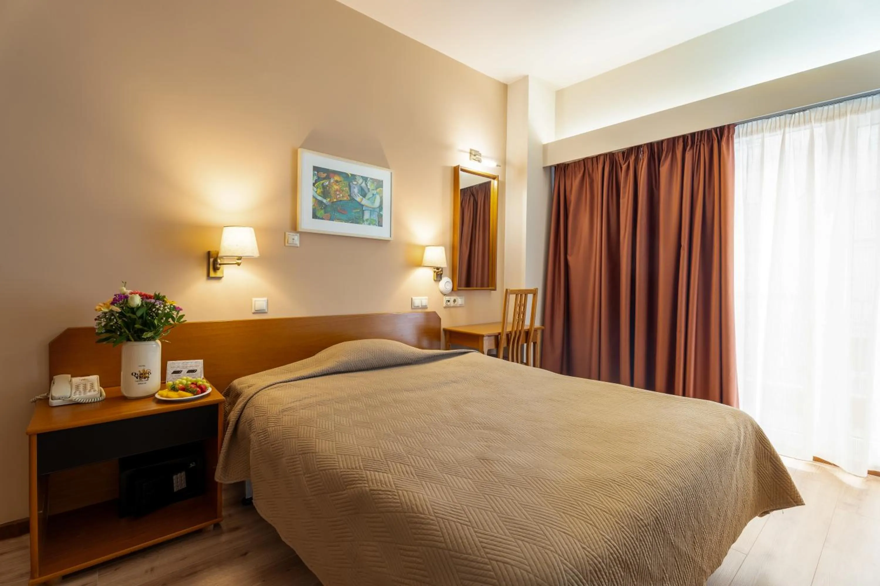 Bed in Queen Olga Hotel