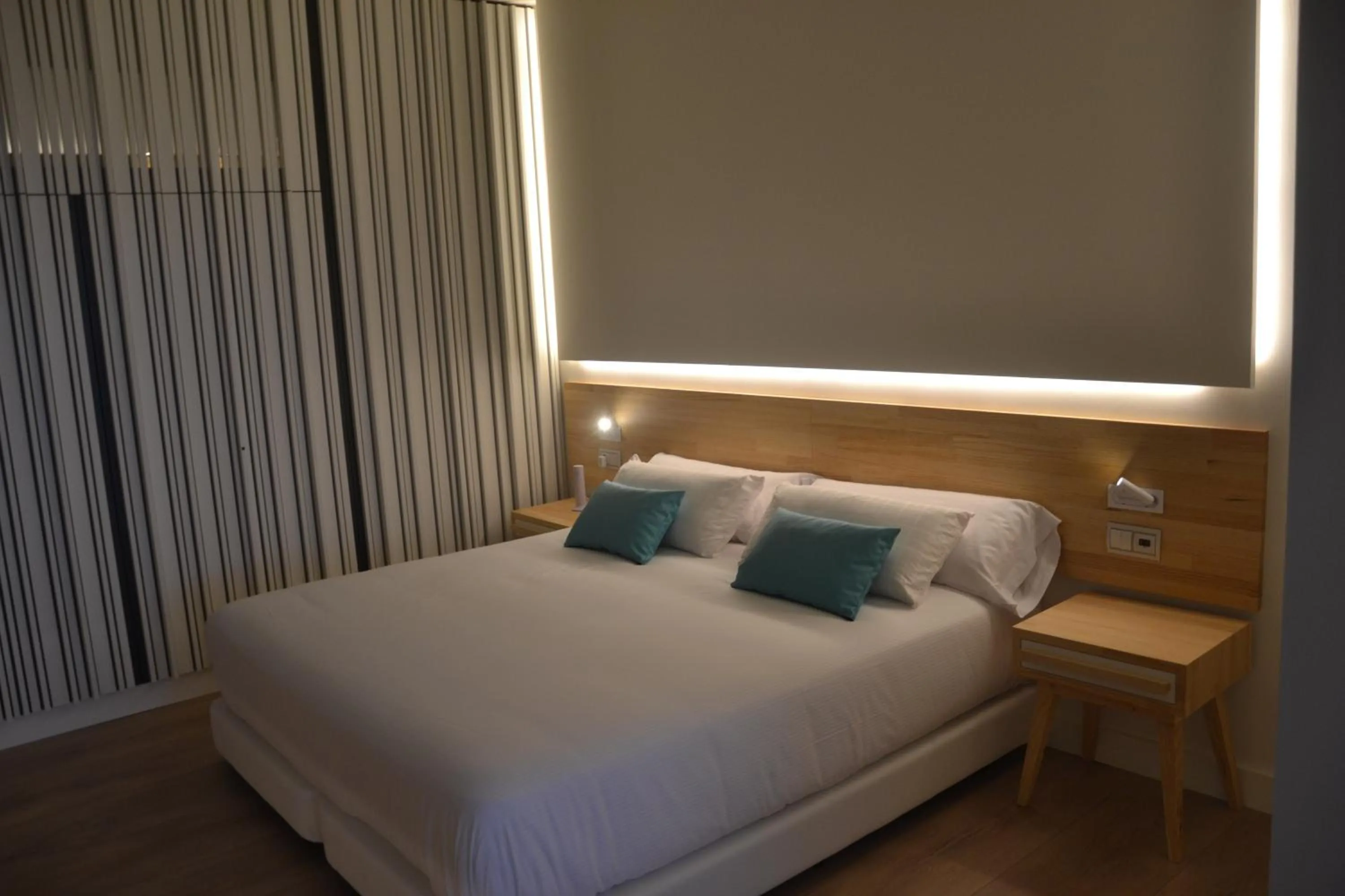 Bed in Hotel Brisamar Suites