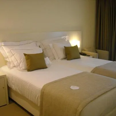 Bed in INLIMA Hotel & Spa