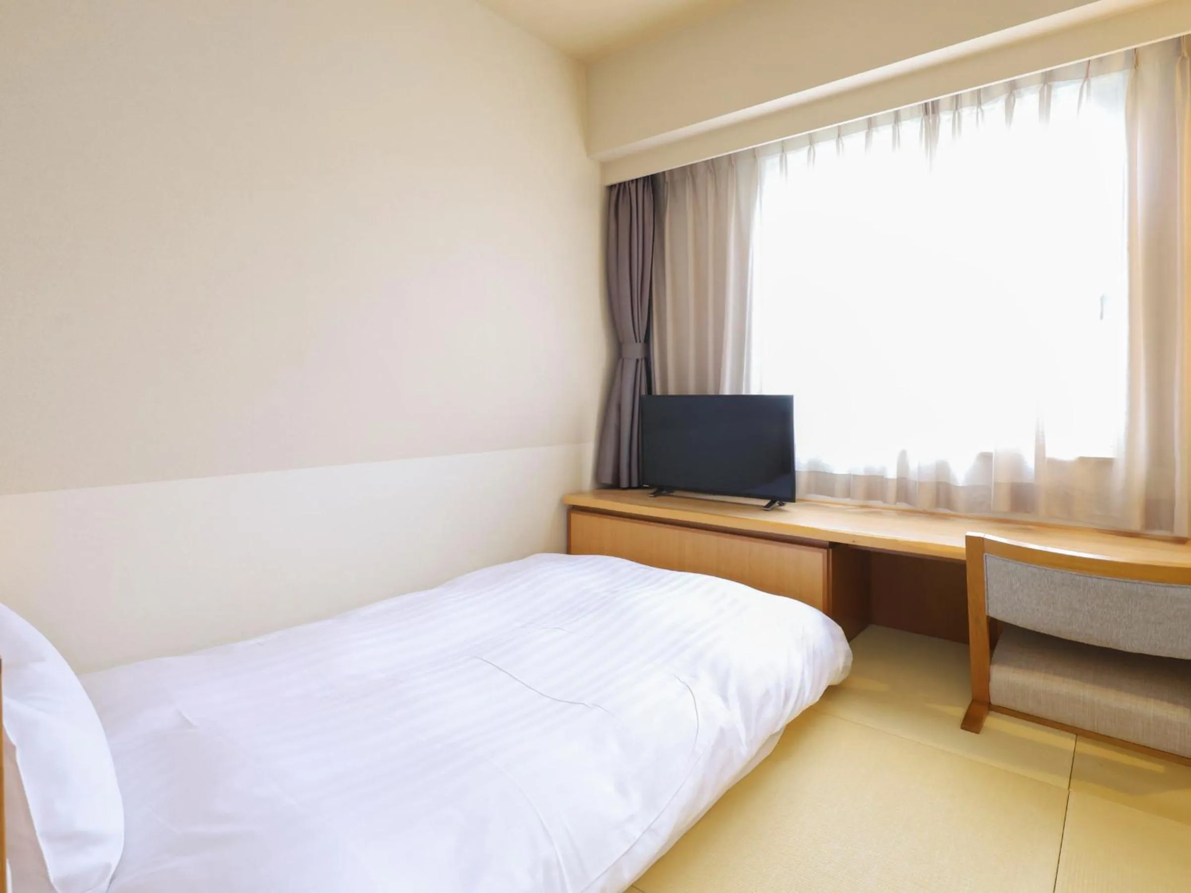 Bed in Dormy Inn Tsu