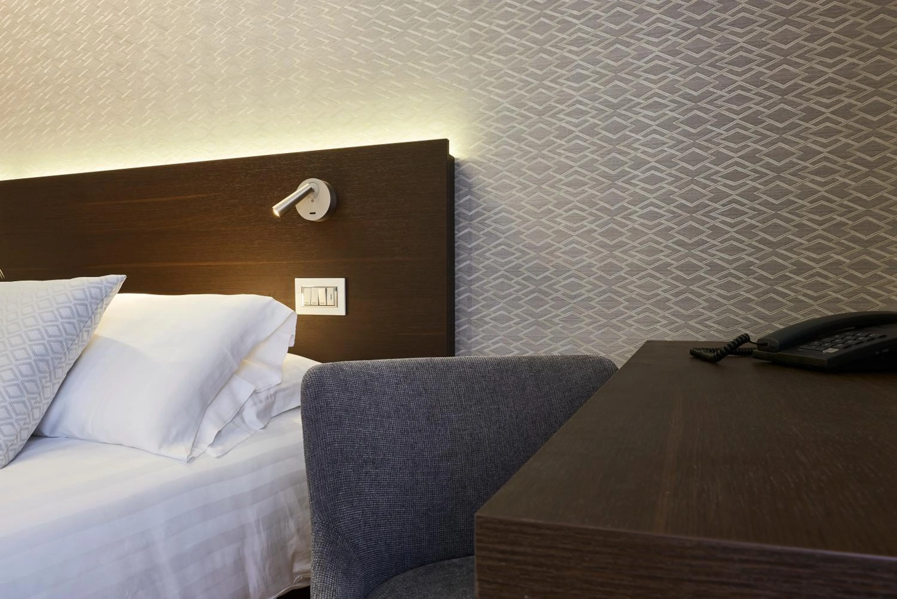 Bed in Hotel Michelangelo