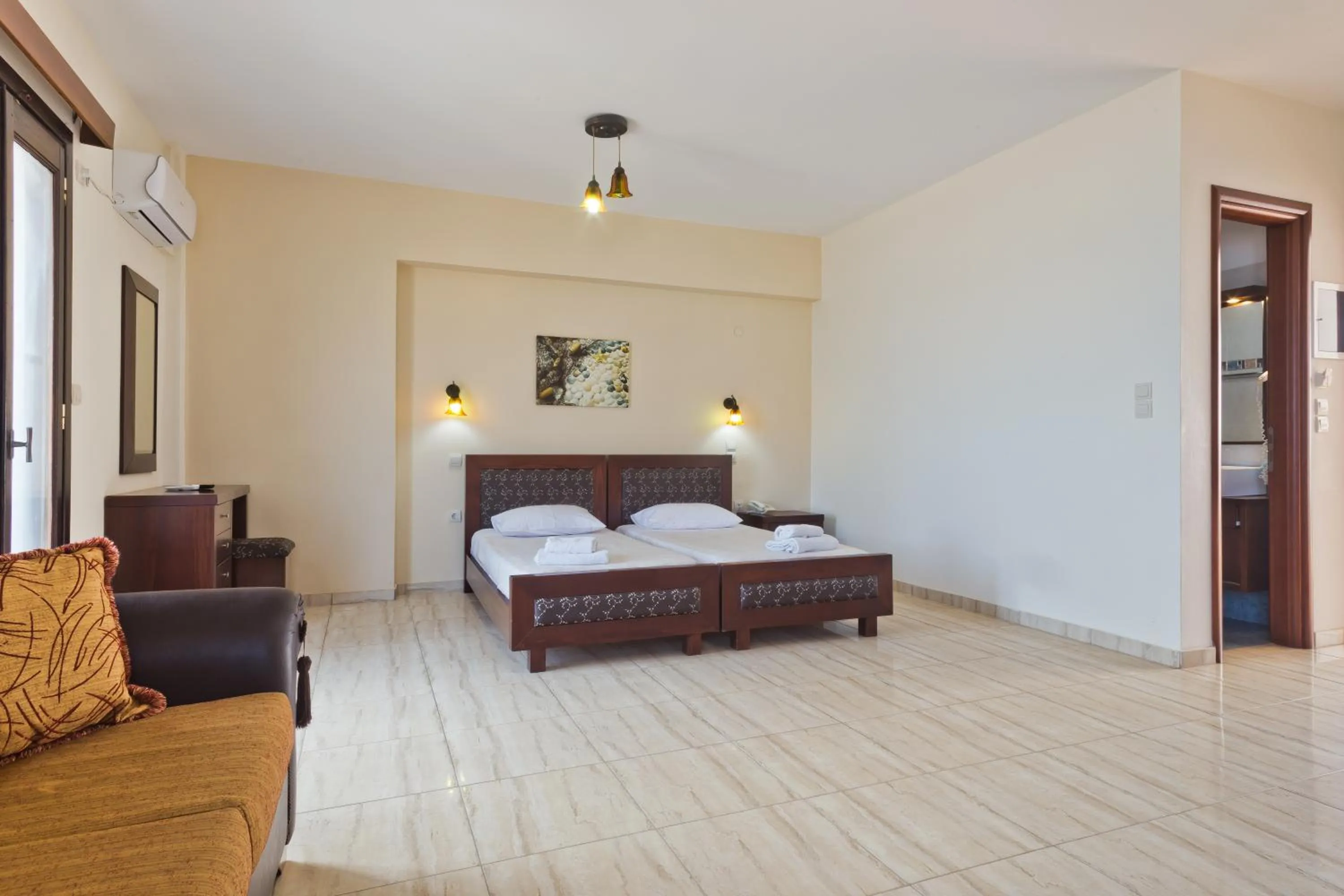 Bed in Arkasa Bay Hotel