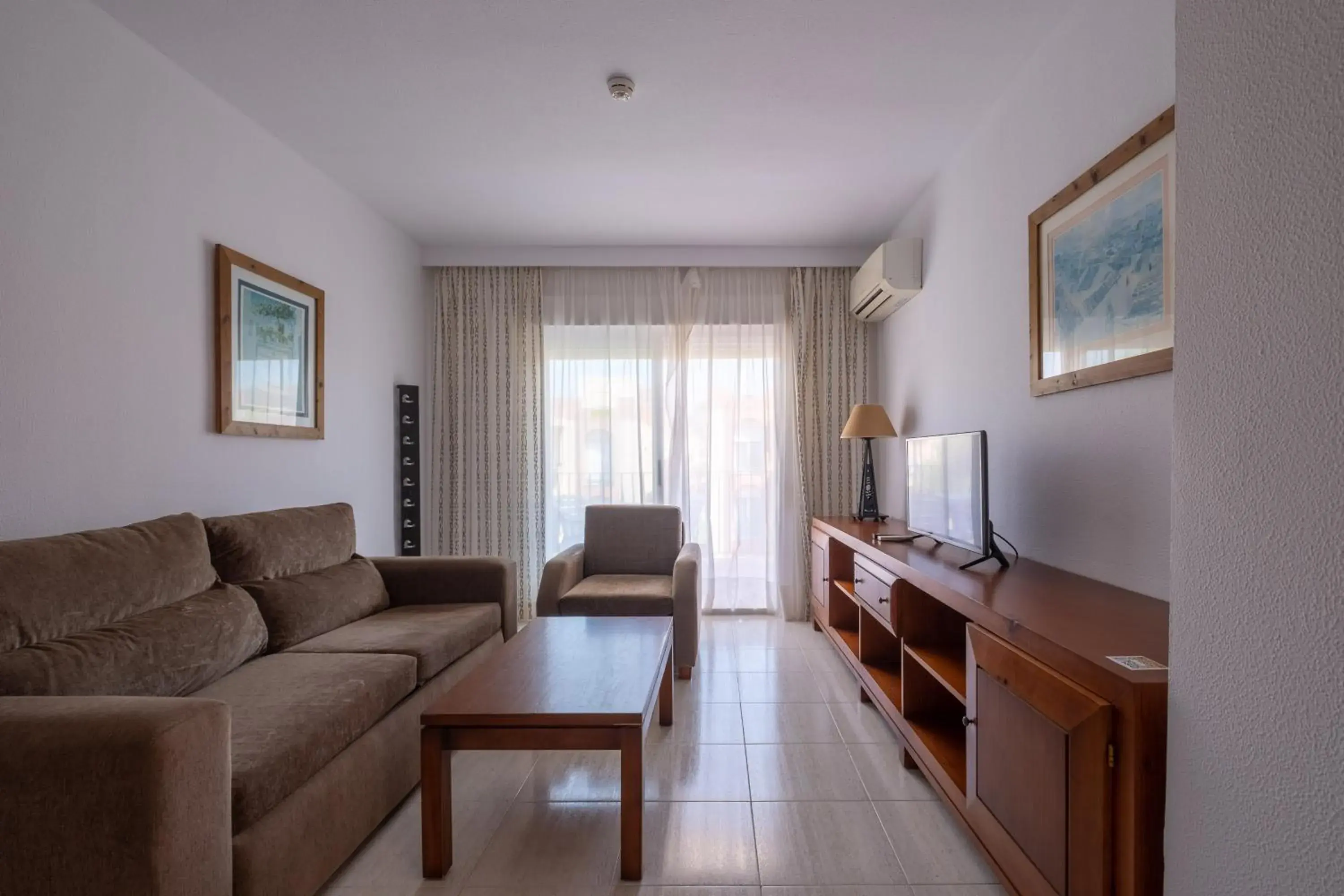 Living room in Aparthotel las Dunas Living room in Aparthotel las Dunas