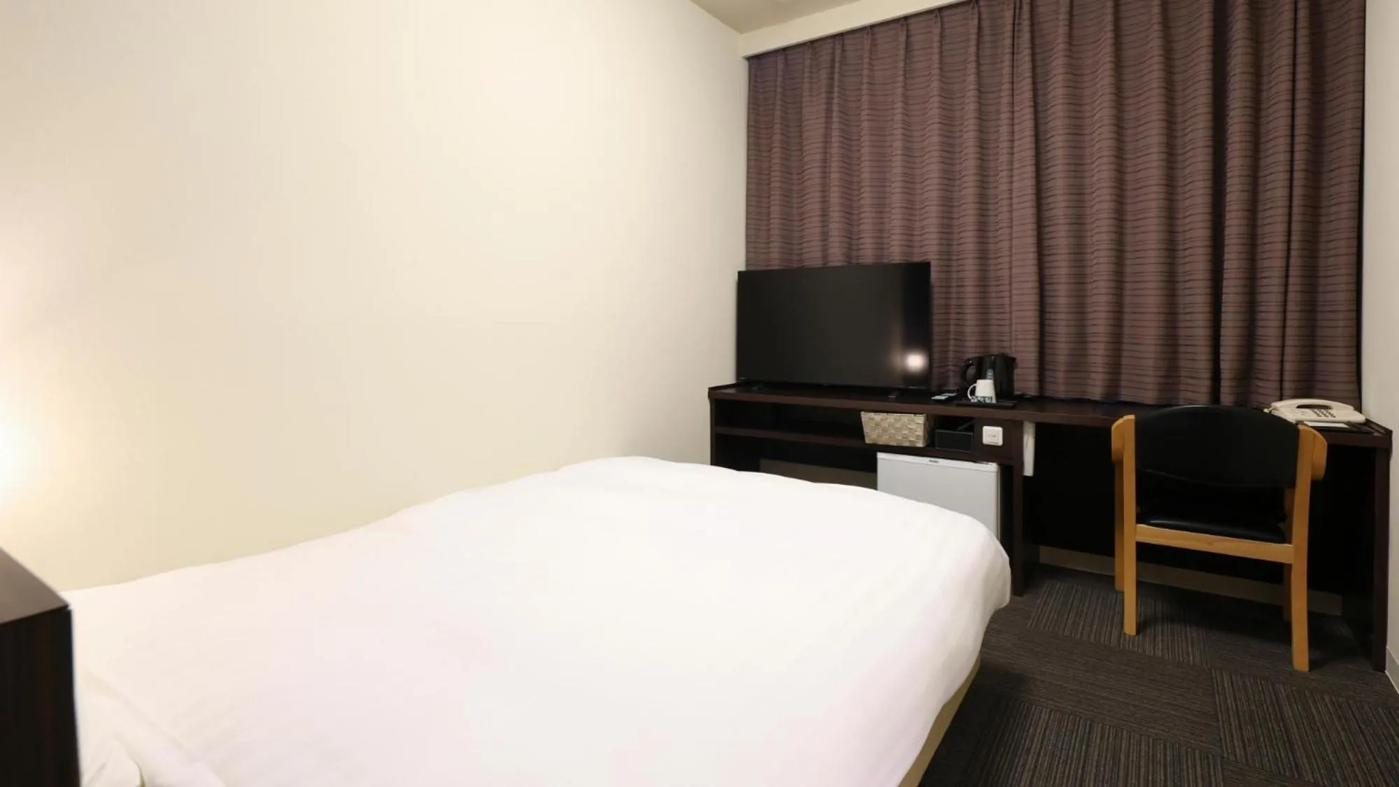 Bed in Dormy Inn Sendai Annex