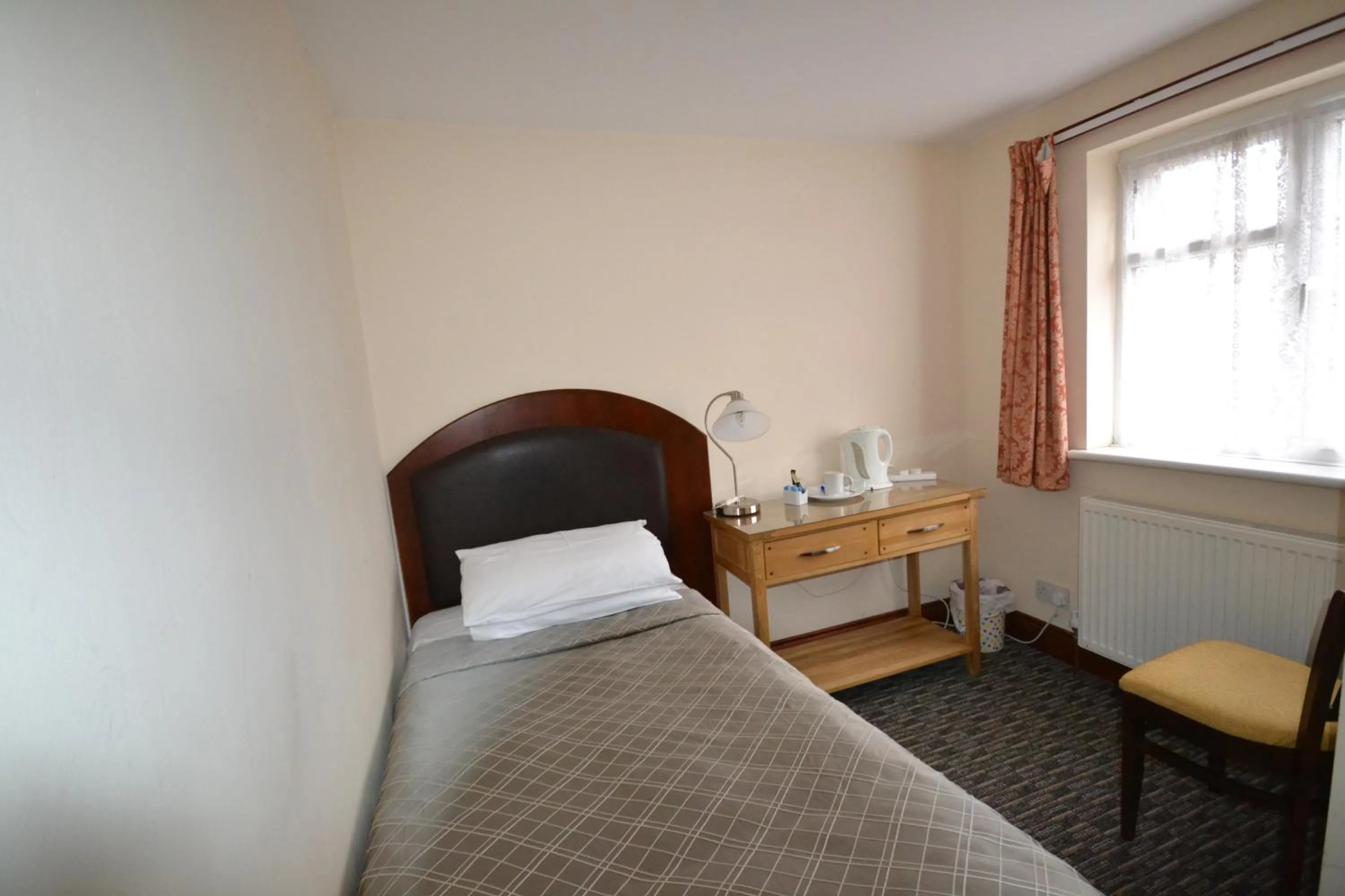 Bed in Airport Guest House