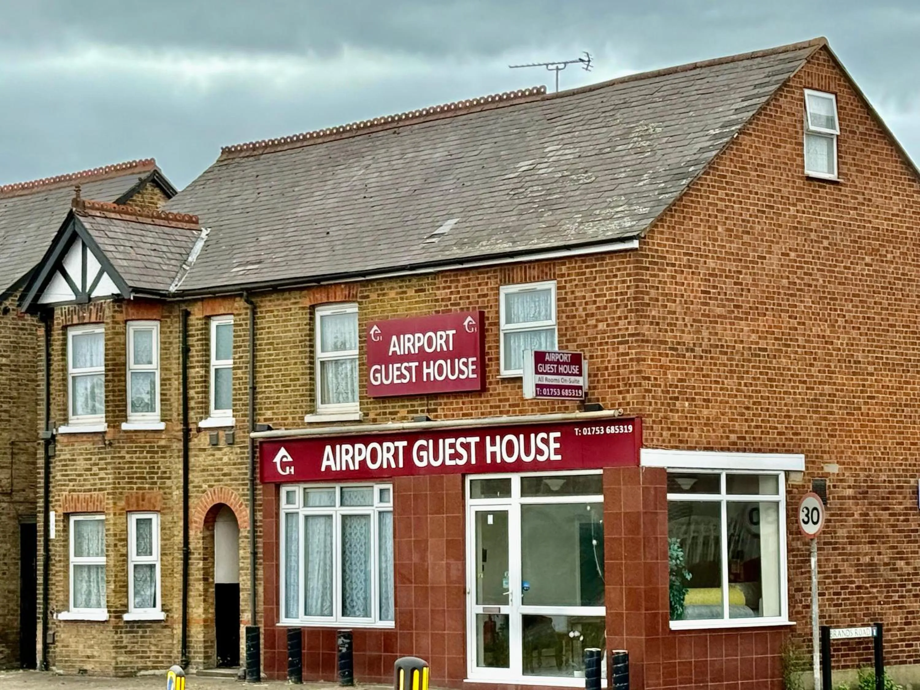 Property logo or sign in Airport Guest House