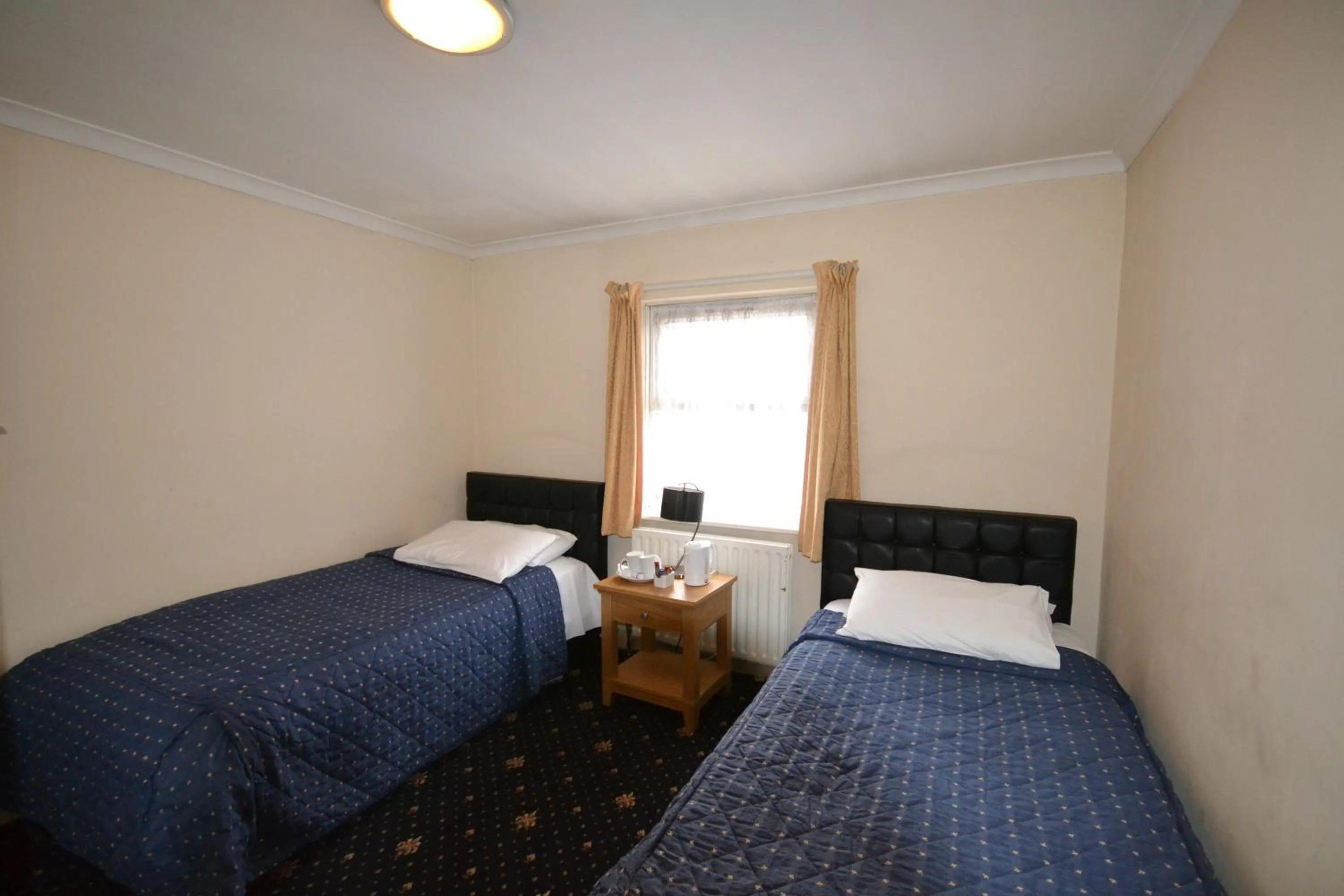 Bed in Airport Guest House