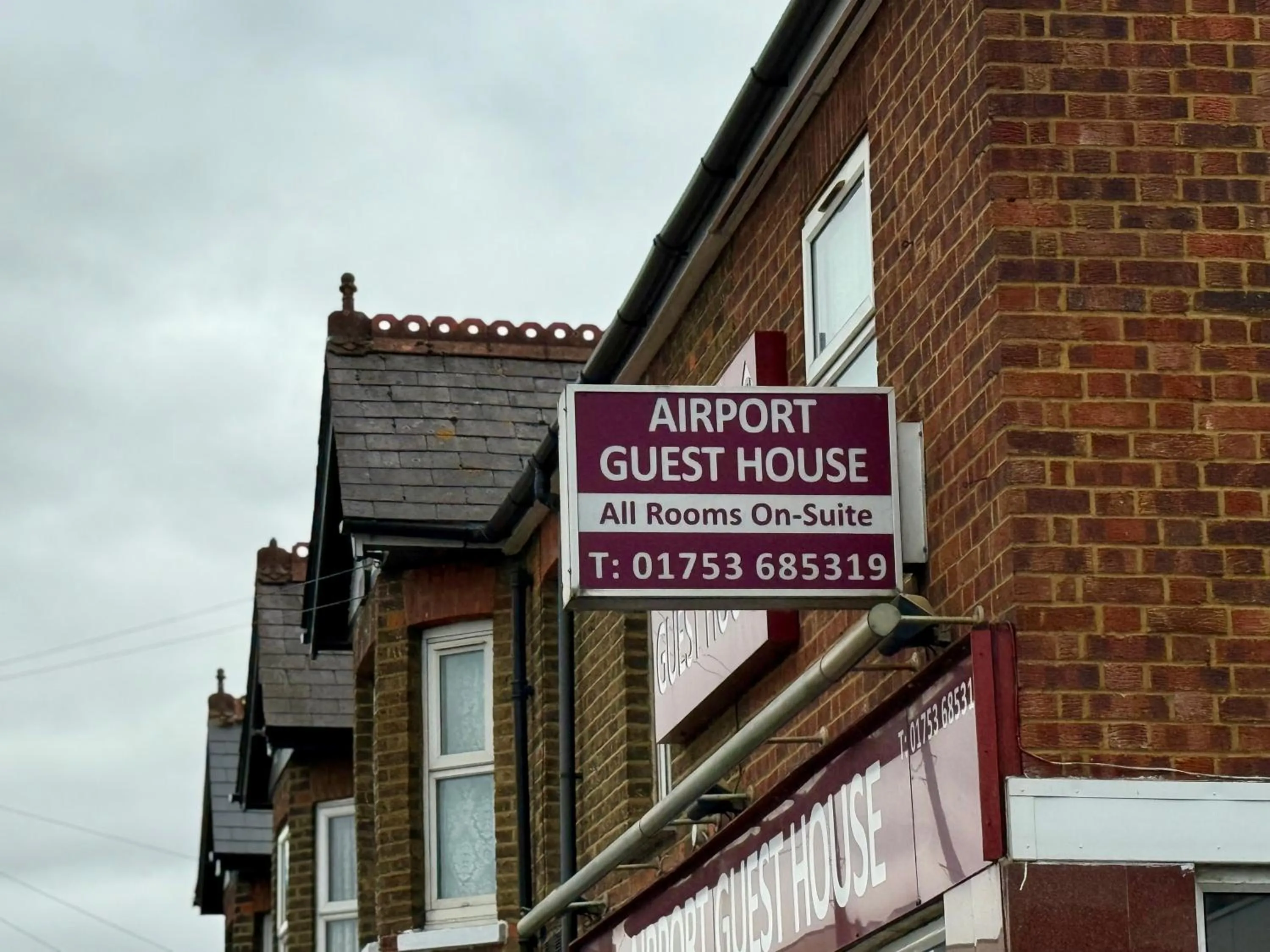 Property logo or sign in Airport Guest House