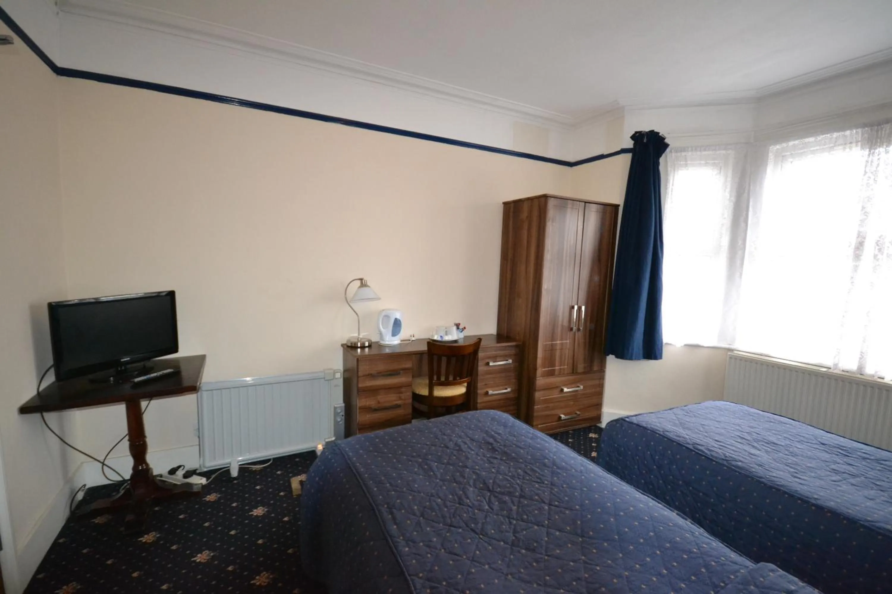 Bed in Airport Guest House