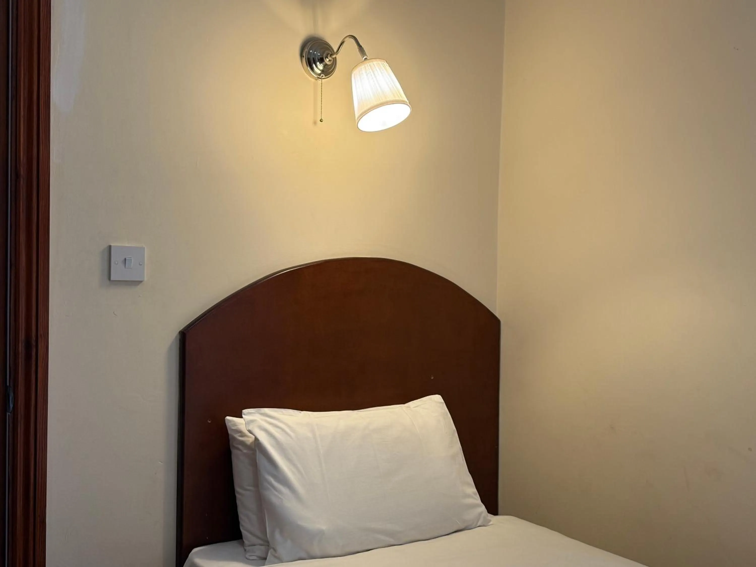 Bed in Airport Guest House