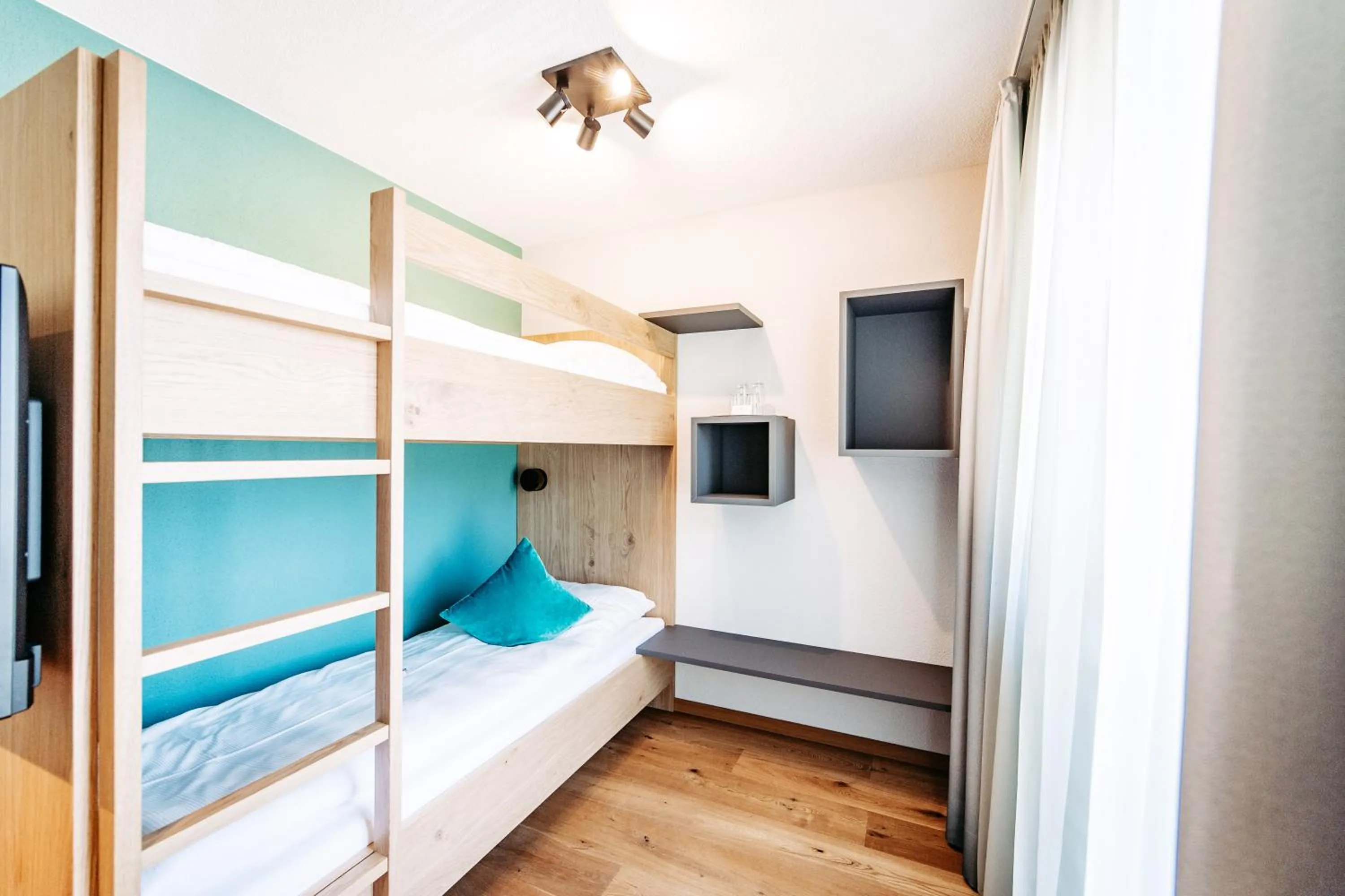 Living room, Bed in Hotel Bradabella - Montafon