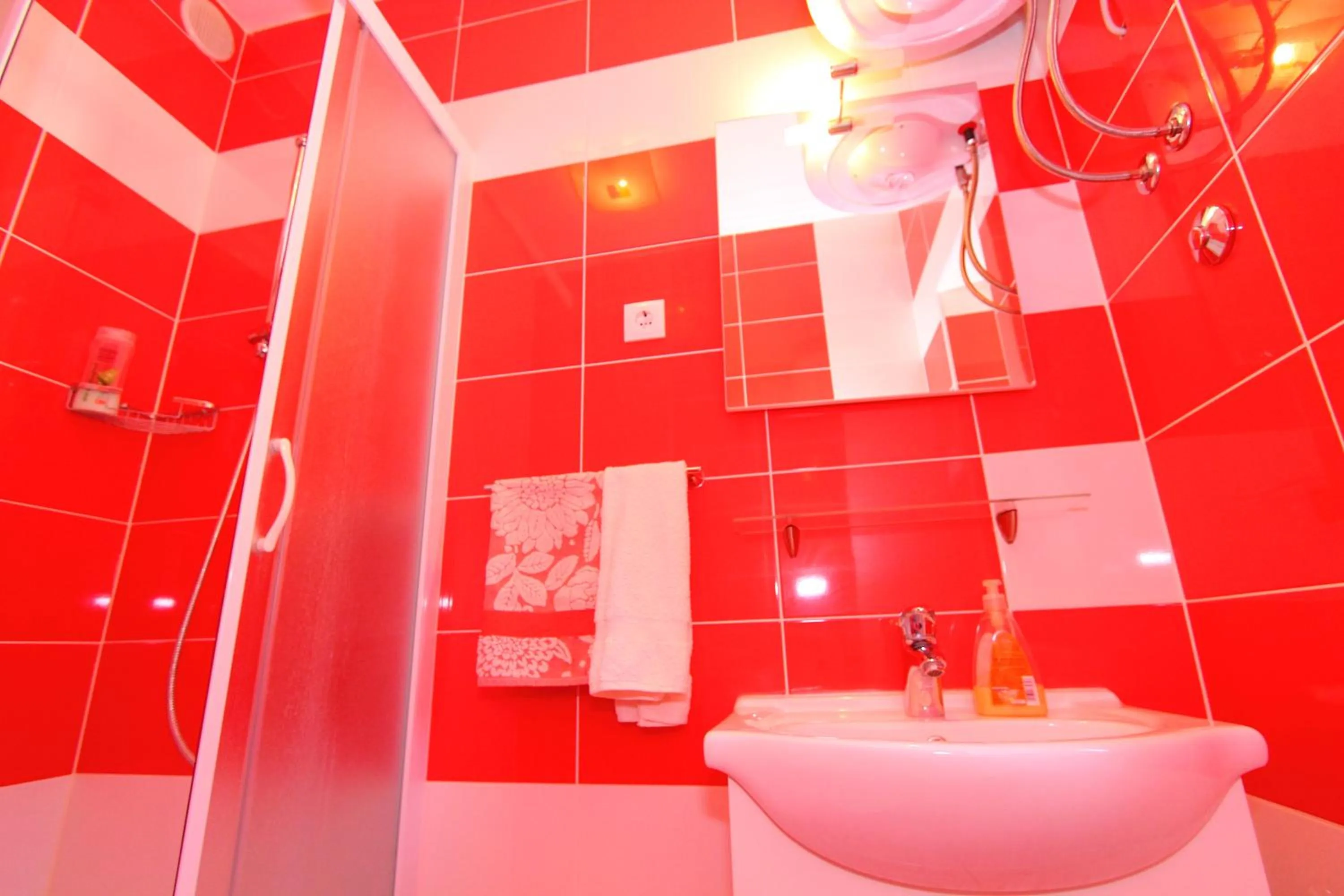 Bathroom in Nirvana Rooms & Apartments