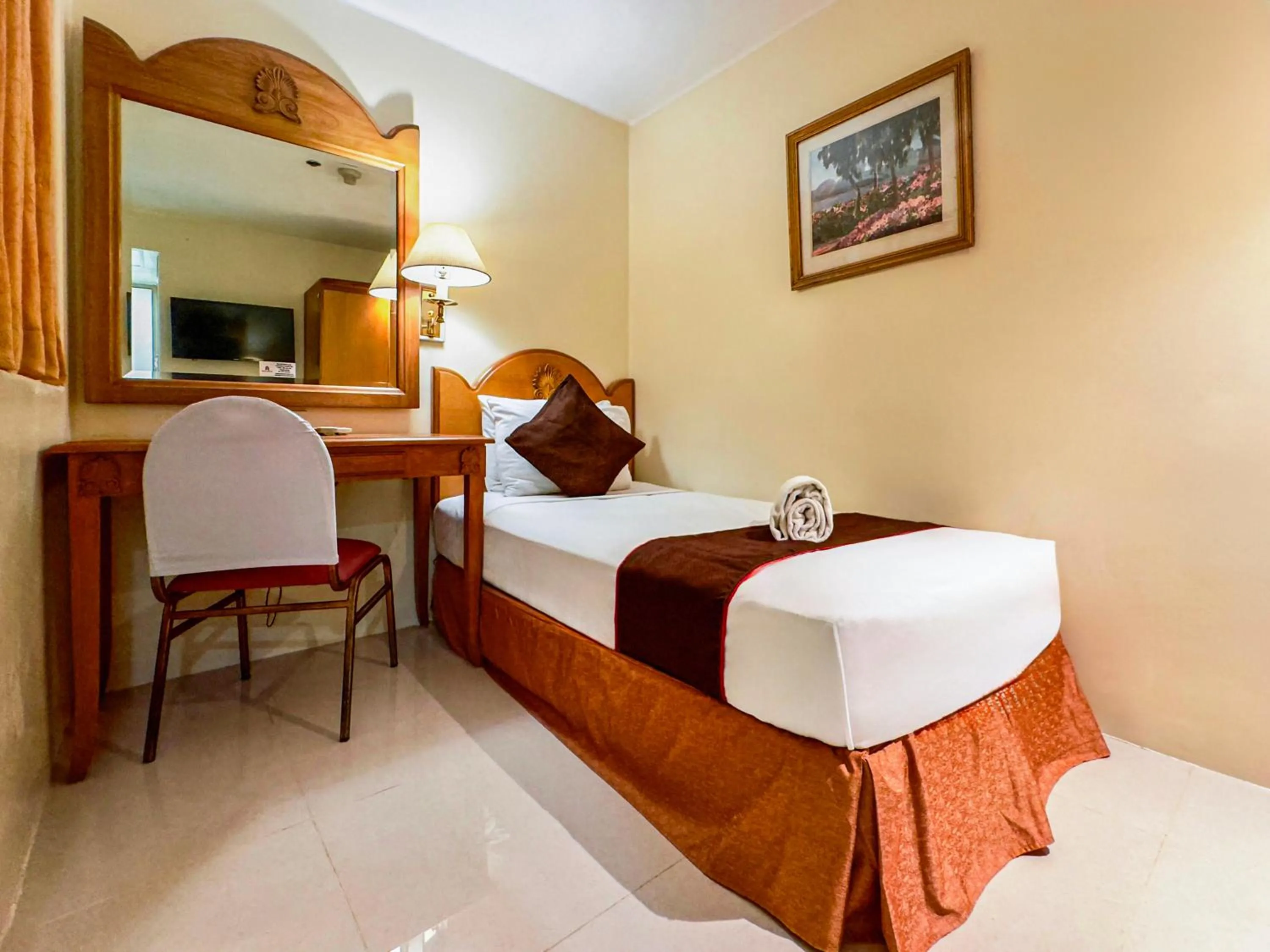 Bed in Palladium Suites Hotel