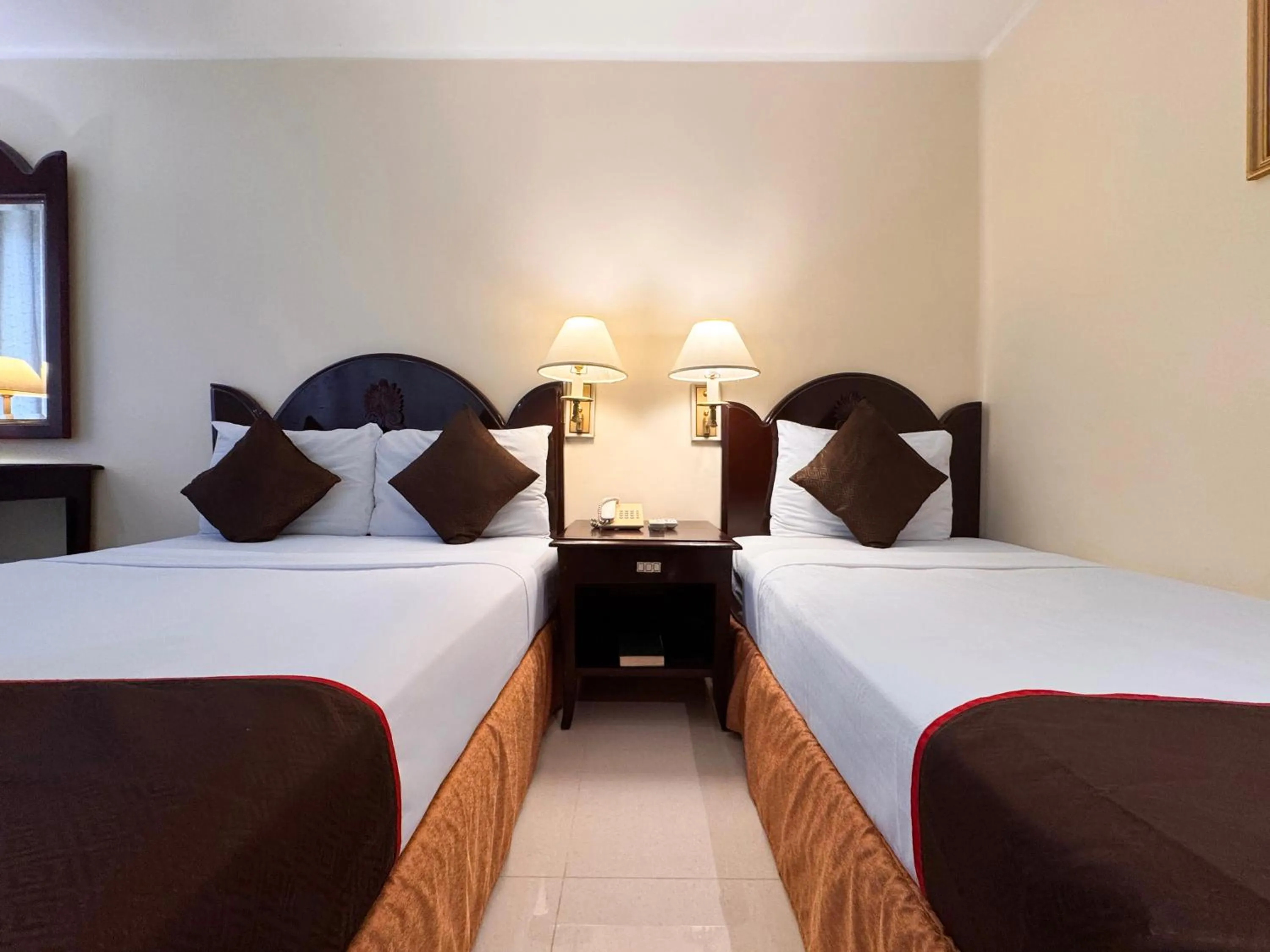 Bed in Palladium Suites Hotel