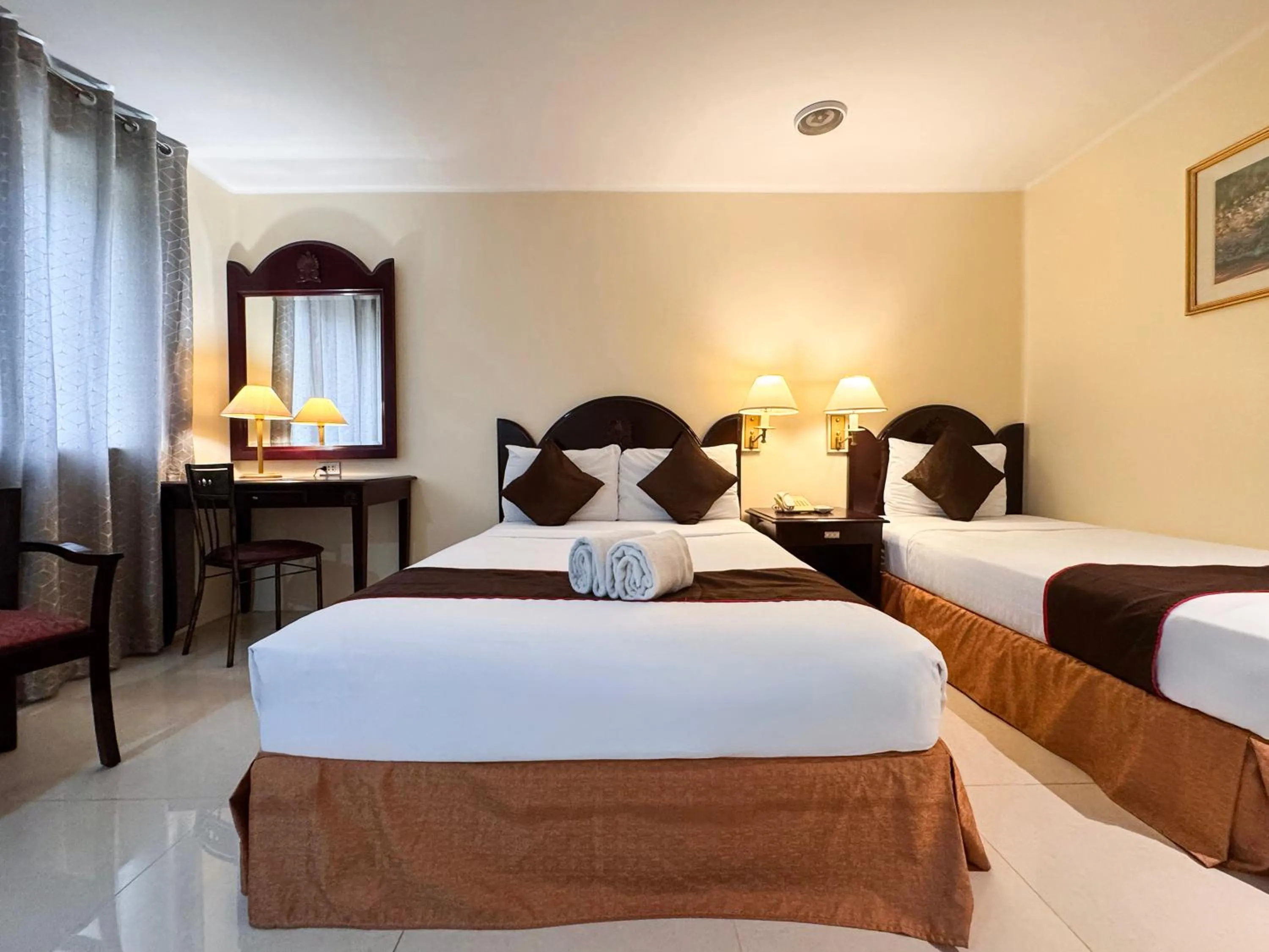 Bed in Palladium Suites Hotel