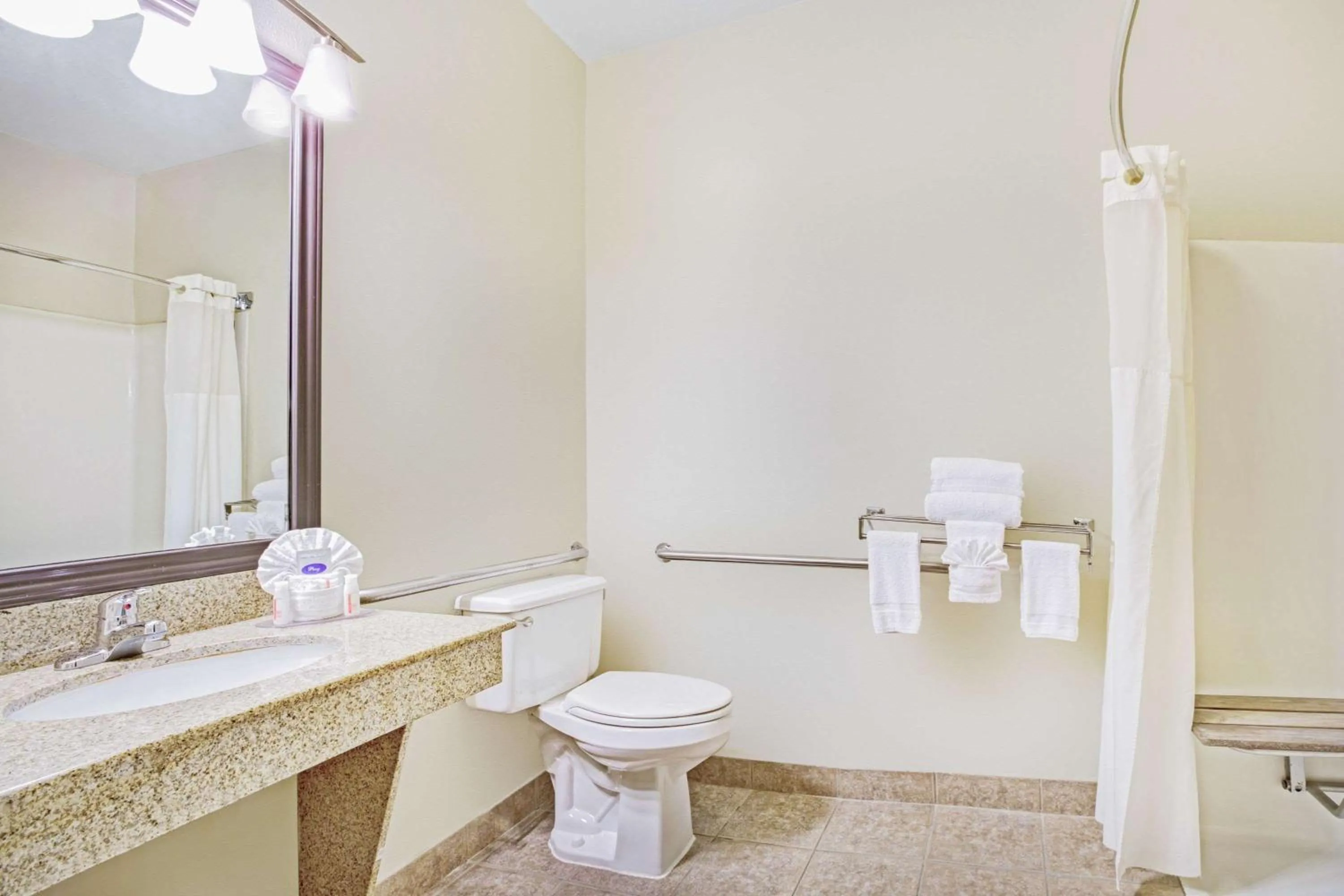 Bathroom in Baymont by Wyndham Dallas/ Love Field