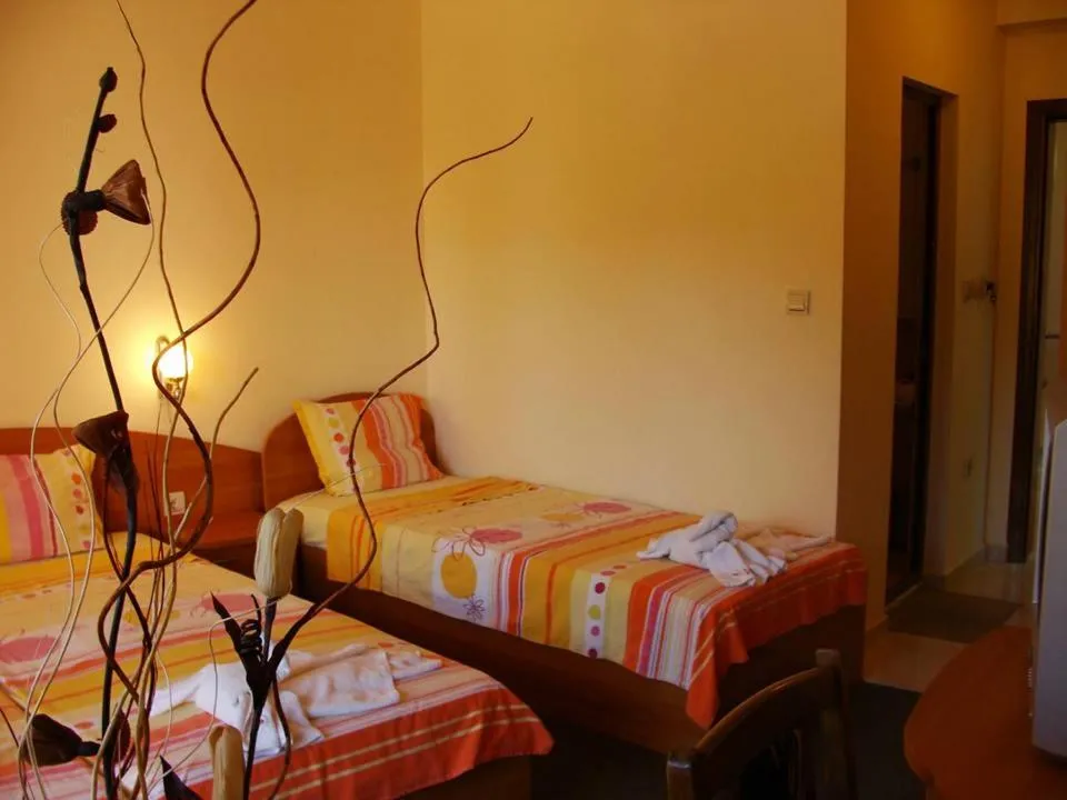 Toilet, Bed in Sunny Paradise Family Hotel