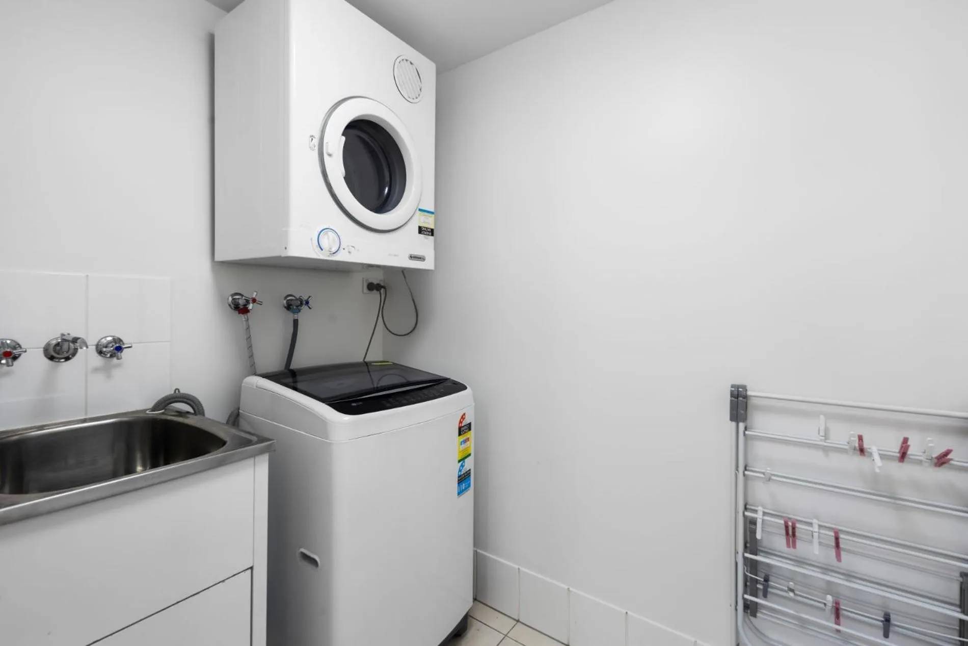 washing machine in Chevron Renaissance - Private Apartments - Hosted by Coastal Letting Co.