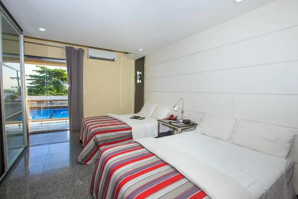 Deluxe Triple Room in Da Vinci Hotel & Conventions by Easy Hotéis Deluxe Triple Room in Da Vinci Hotel & Conventions by Easy Hotéis