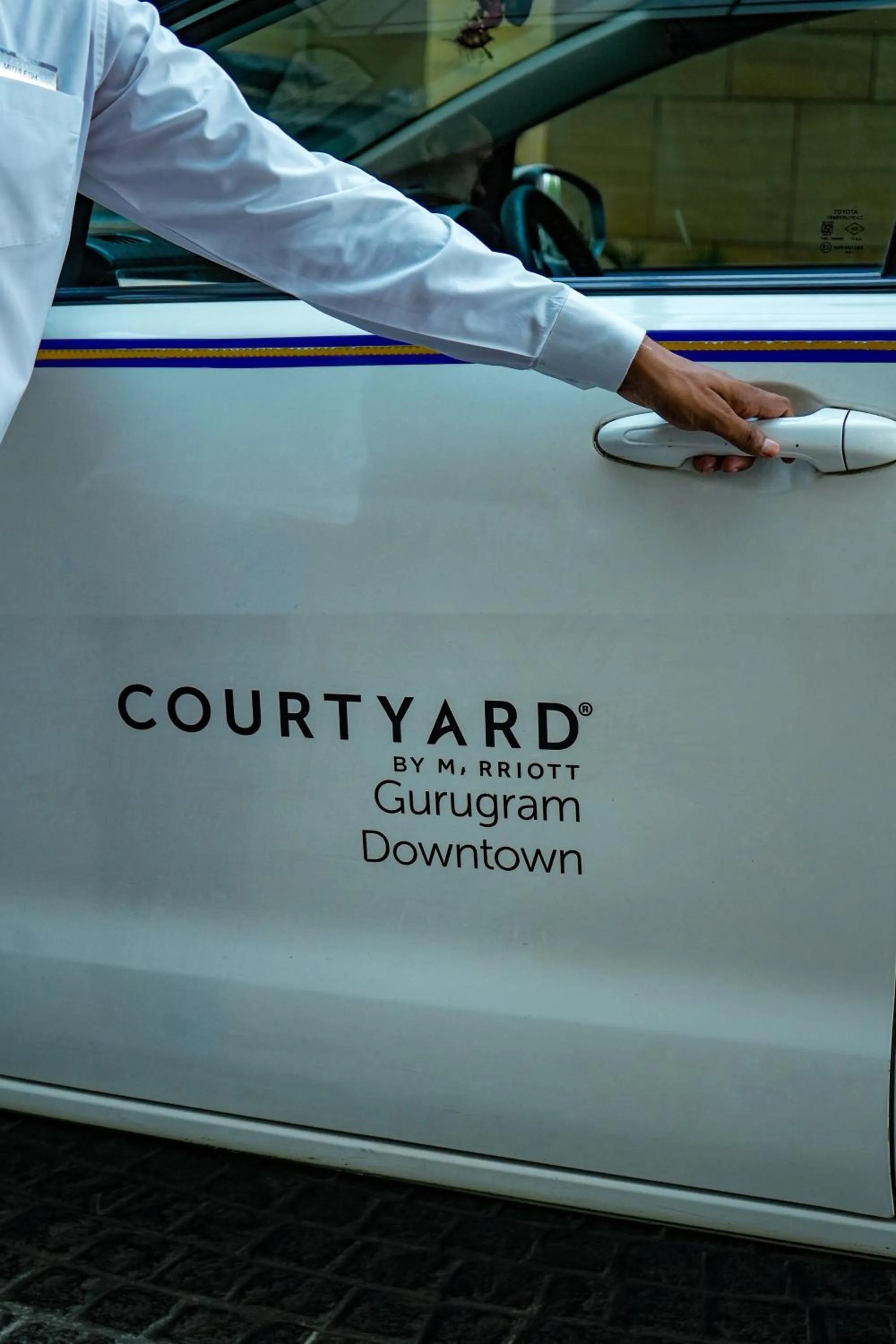 Text overlay in Courtyard by Marriott Gurugram Downtown
