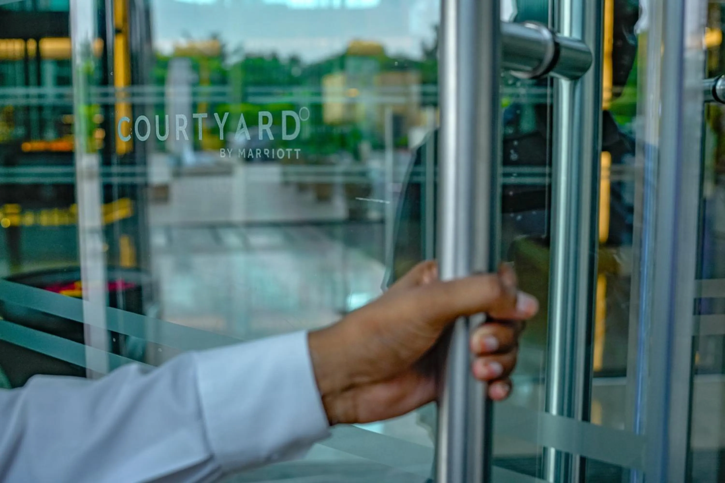 Text overlay in Courtyard by Marriott Gurugram Downtown