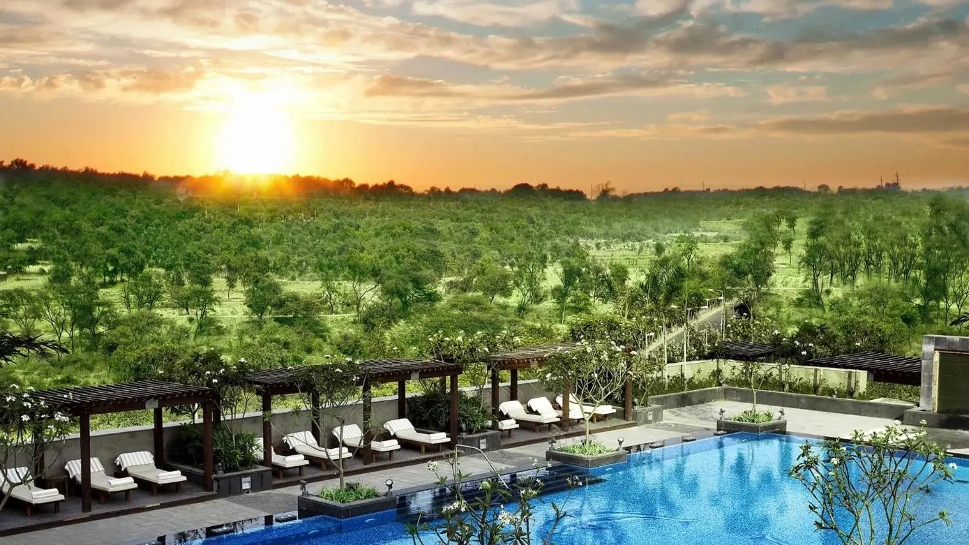 Swimming pool in The Leela Ambience Gurugram Hotel & Residences - The Luxury Urban Sanctuary Swimming pool in The Leela Ambience Gurugram Hotel & Residences - The Luxury Urban Sanctuary