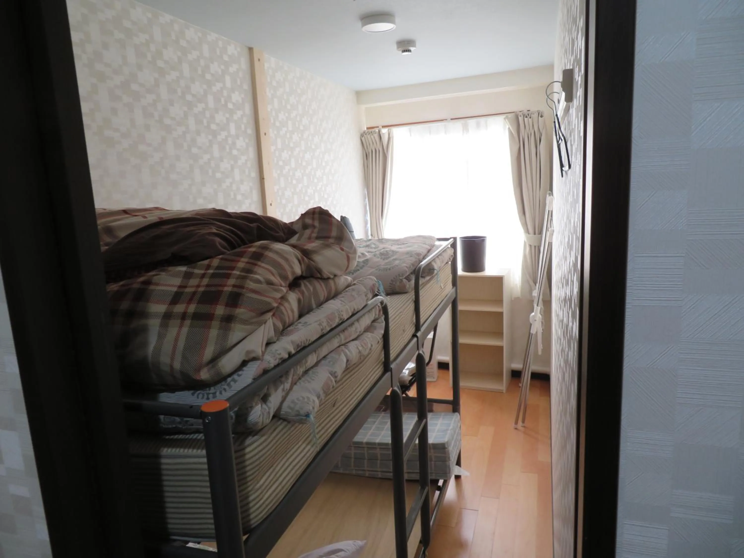 Bed in Sapporo Guest House Nariya
