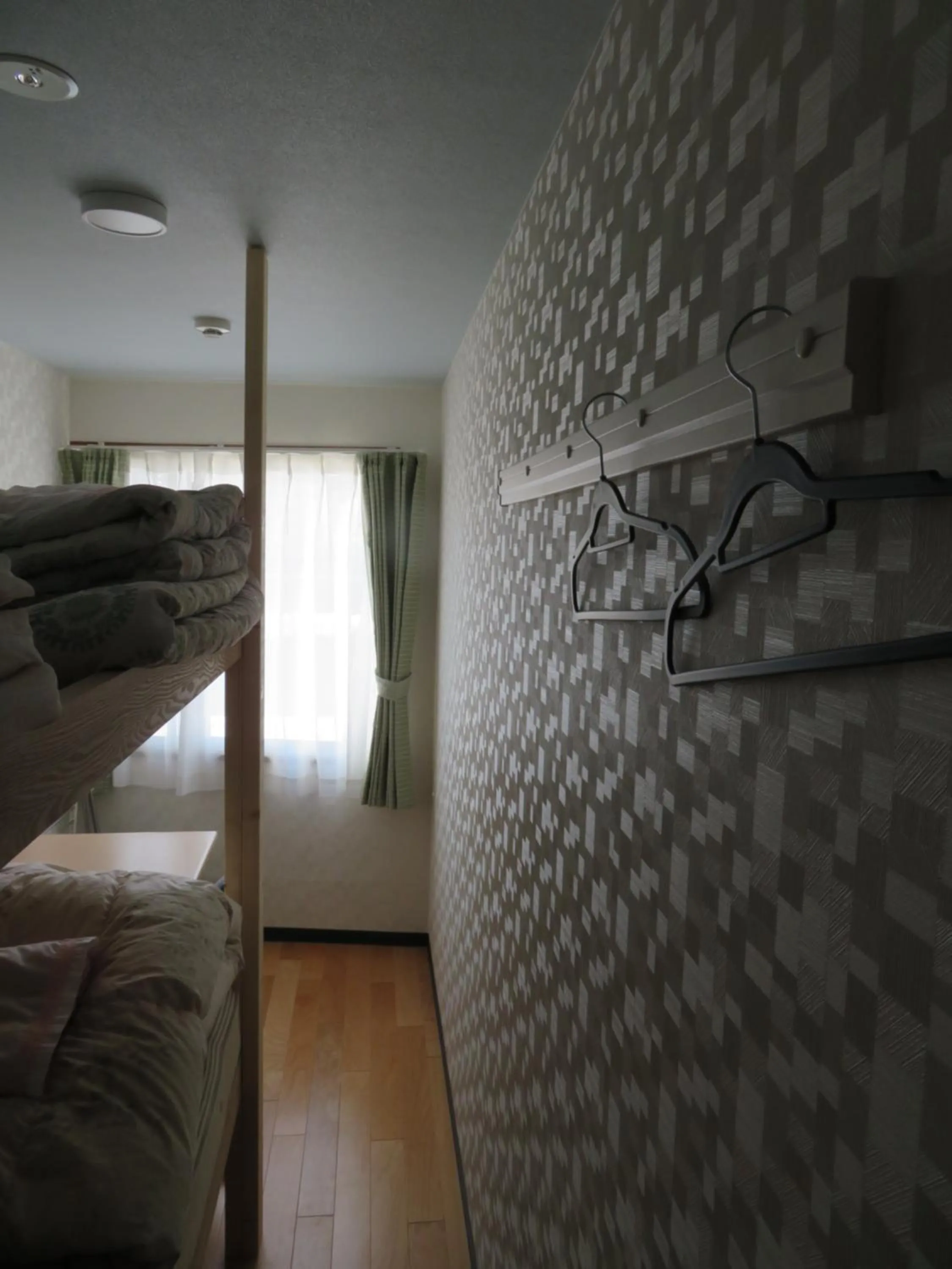 Bed in Sapporo Guest House Nariya