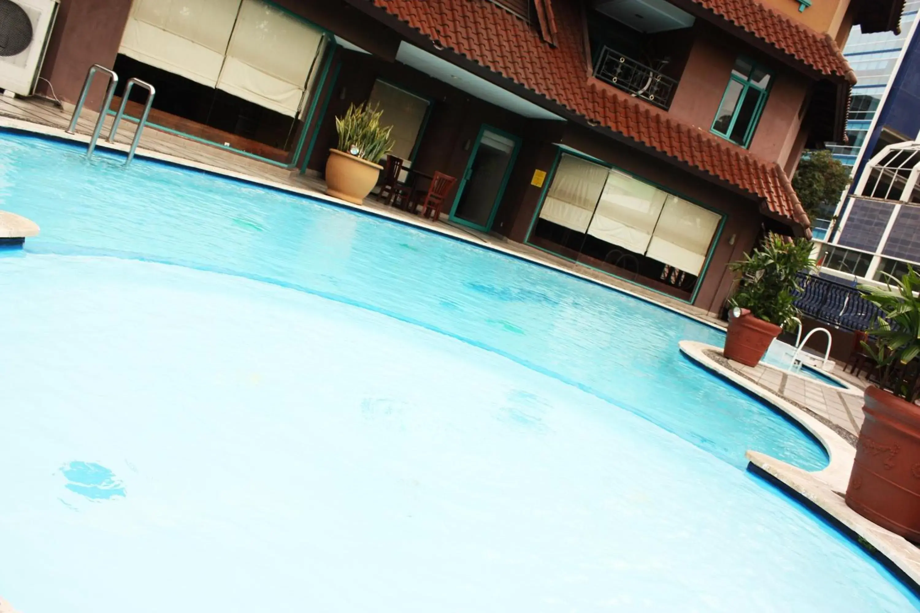 Swimming pool in Travellers Suites Serviced Apartments Swimming pool in Travellers Suites Serviced Apartments