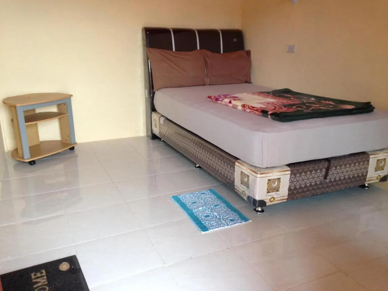 Bed in Aman's Guesthouse