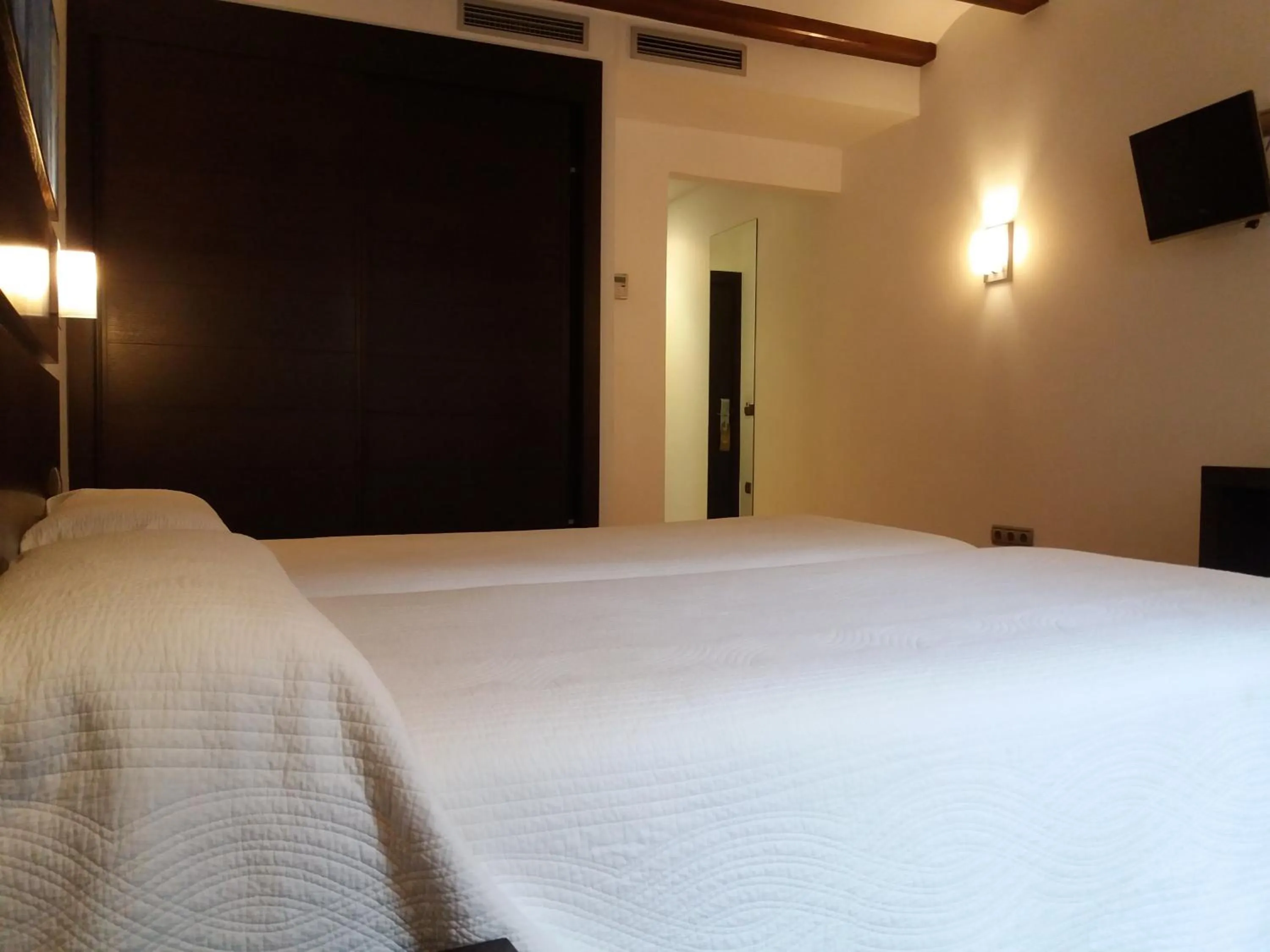 Bed in Hotel Rey Sancho