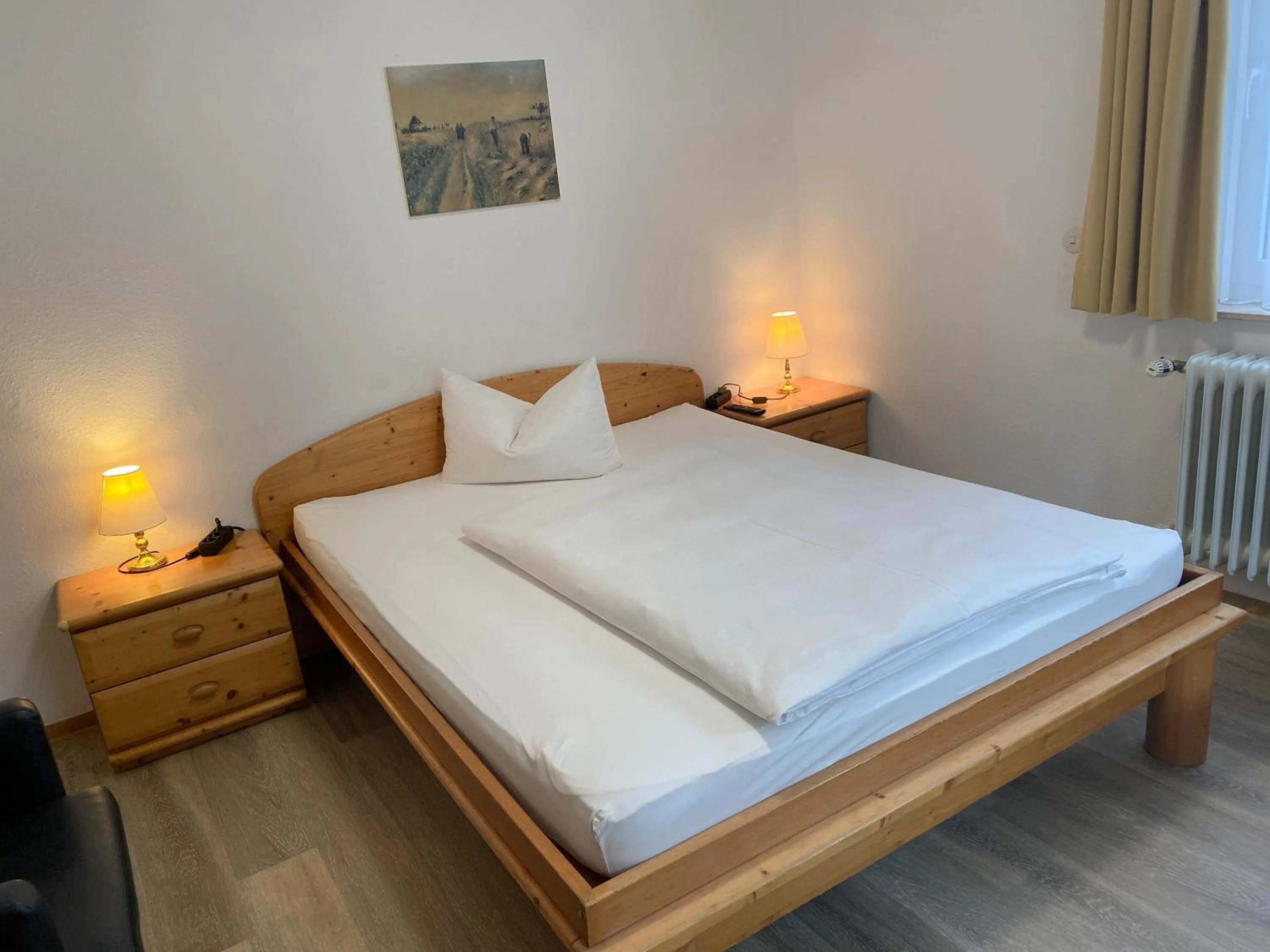 Photo of the whole room, Bed in Hotel Rosengarten Tuttlingen