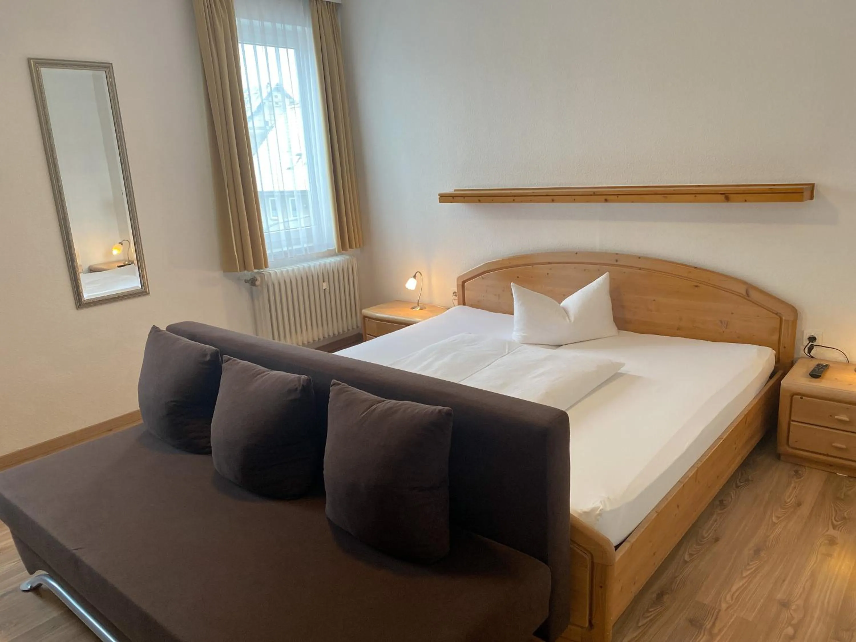 Photo of the whole room, Bed in Hotel Rosengarten Tuttlingen