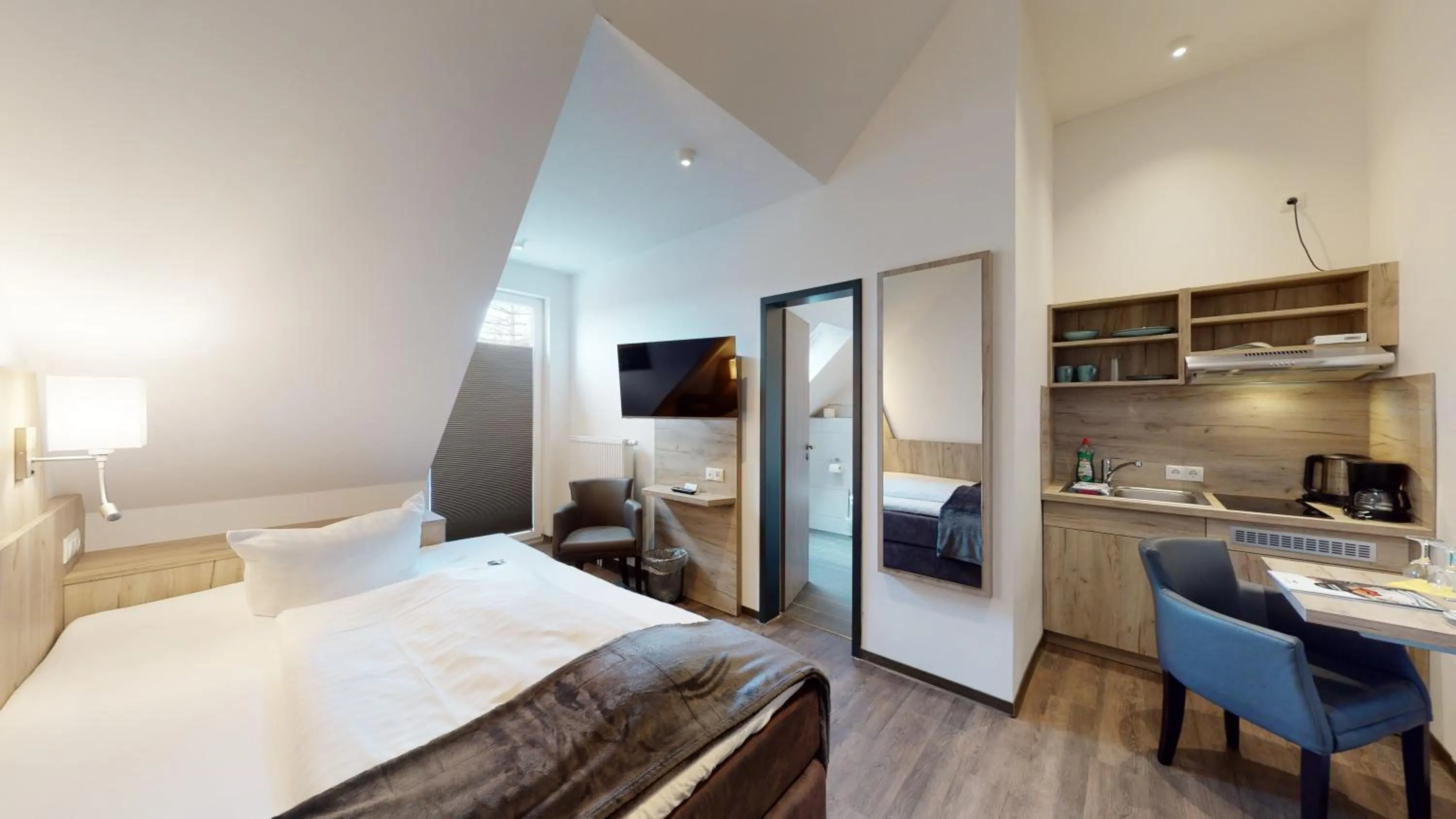 Photo of the whole room, Bed in WH Hotels Papenburg Zentrum