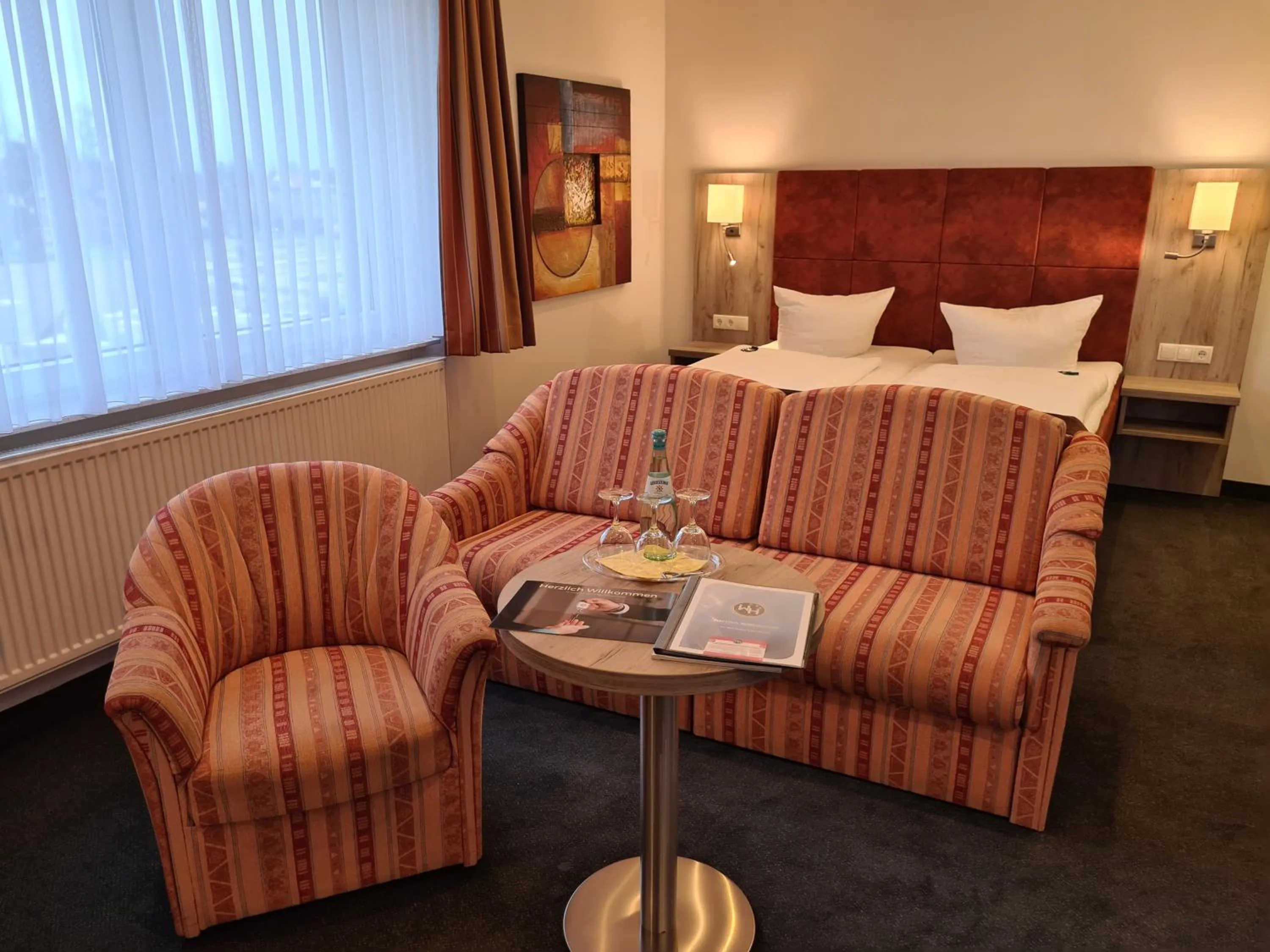 Photo of the whole room, Bed in WH Hotels Papenburg Zentrum