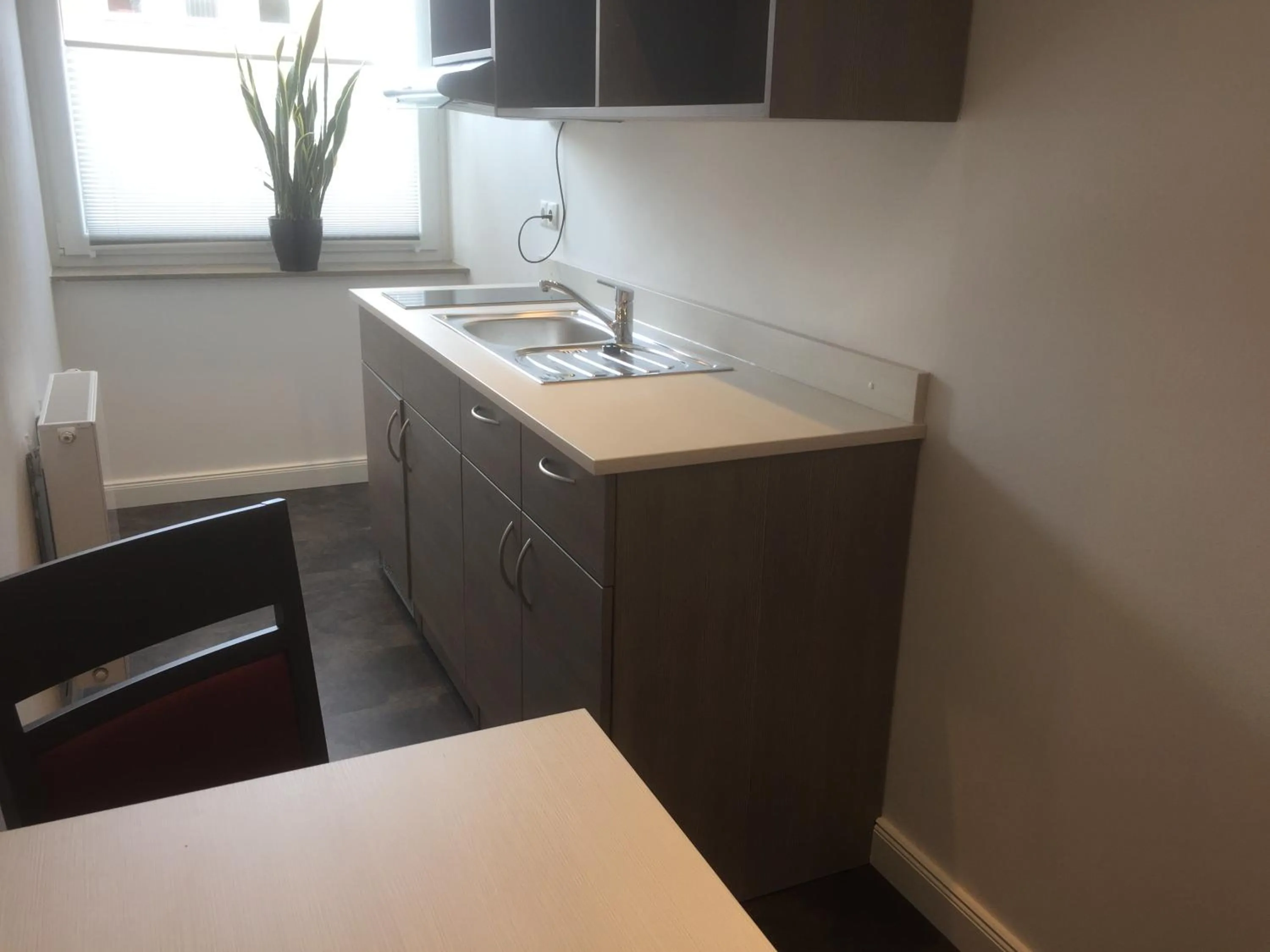 Kitchen or kitchenette in WH Hotels Papenburg Zentrum