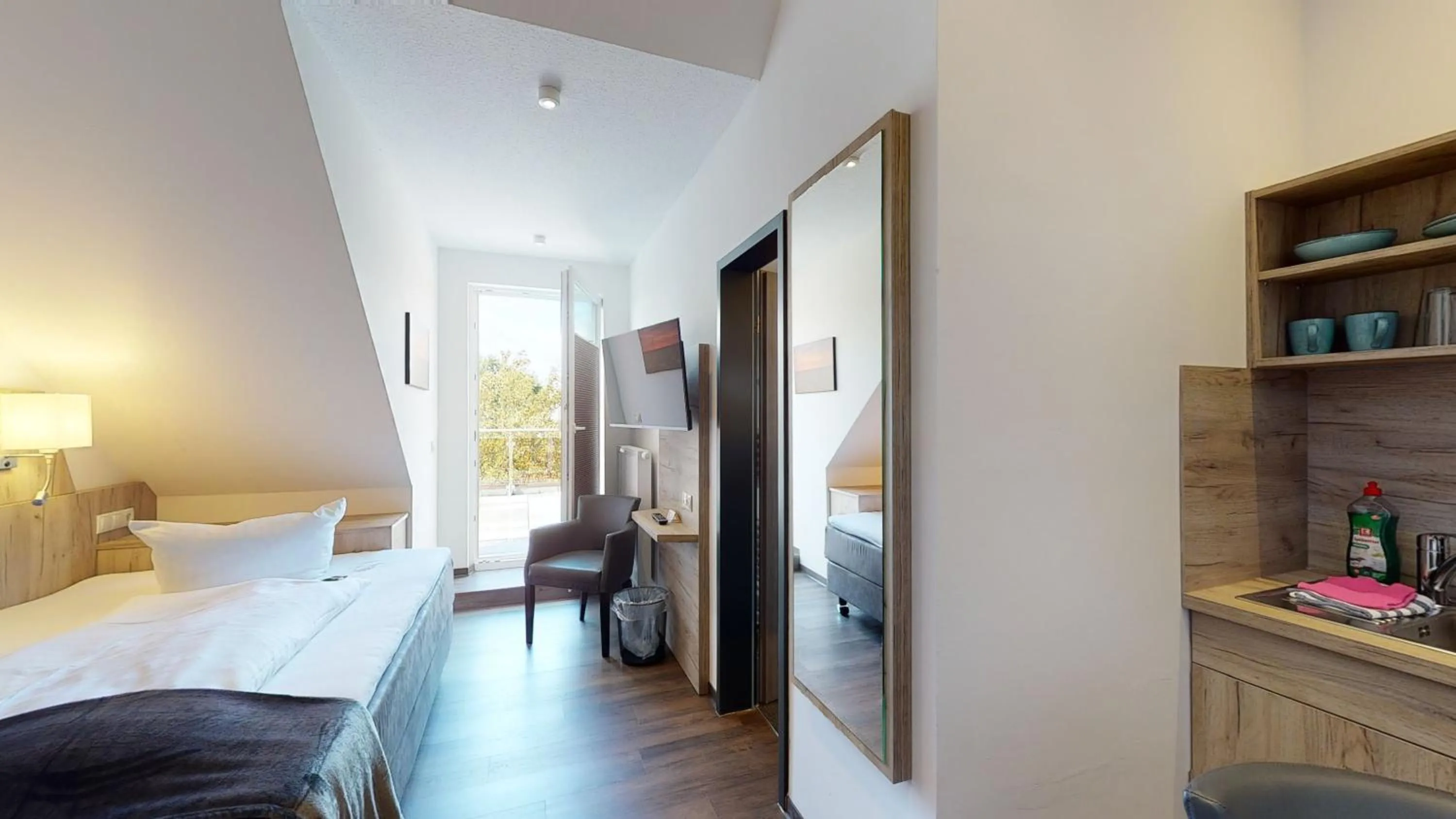 Kitchen or kitchenette, Bed in WH Hotels Papenburg Zentrum