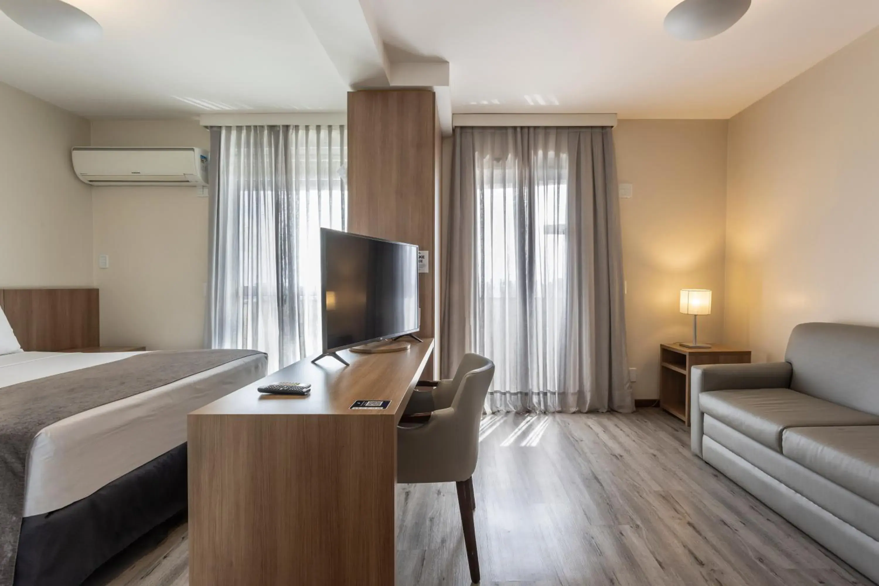 Living room, Bed in Blue Tree Towers Millenium Porto Alegre Living room, Bed in Blue Tree Towers Millenium Porto Alegre