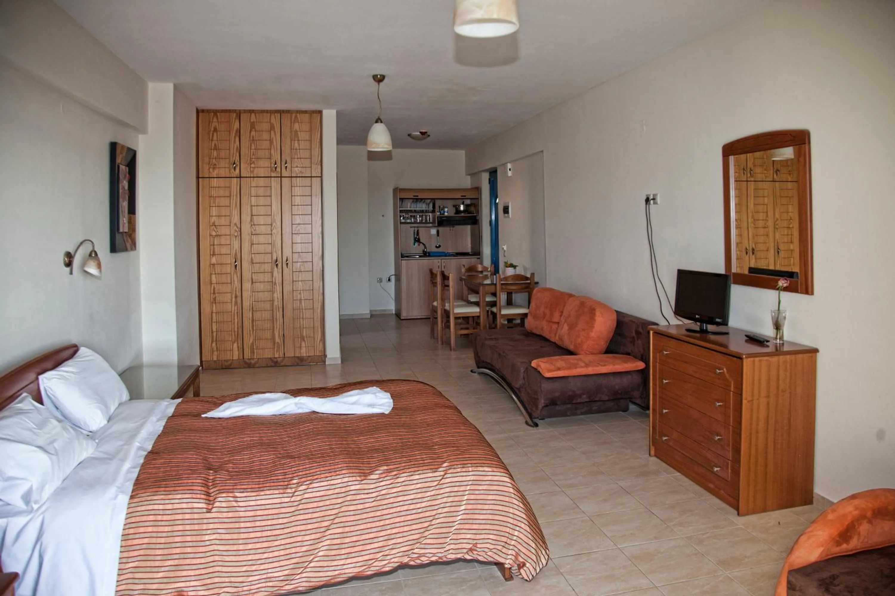 Dining area, Bed in Gold Apartments